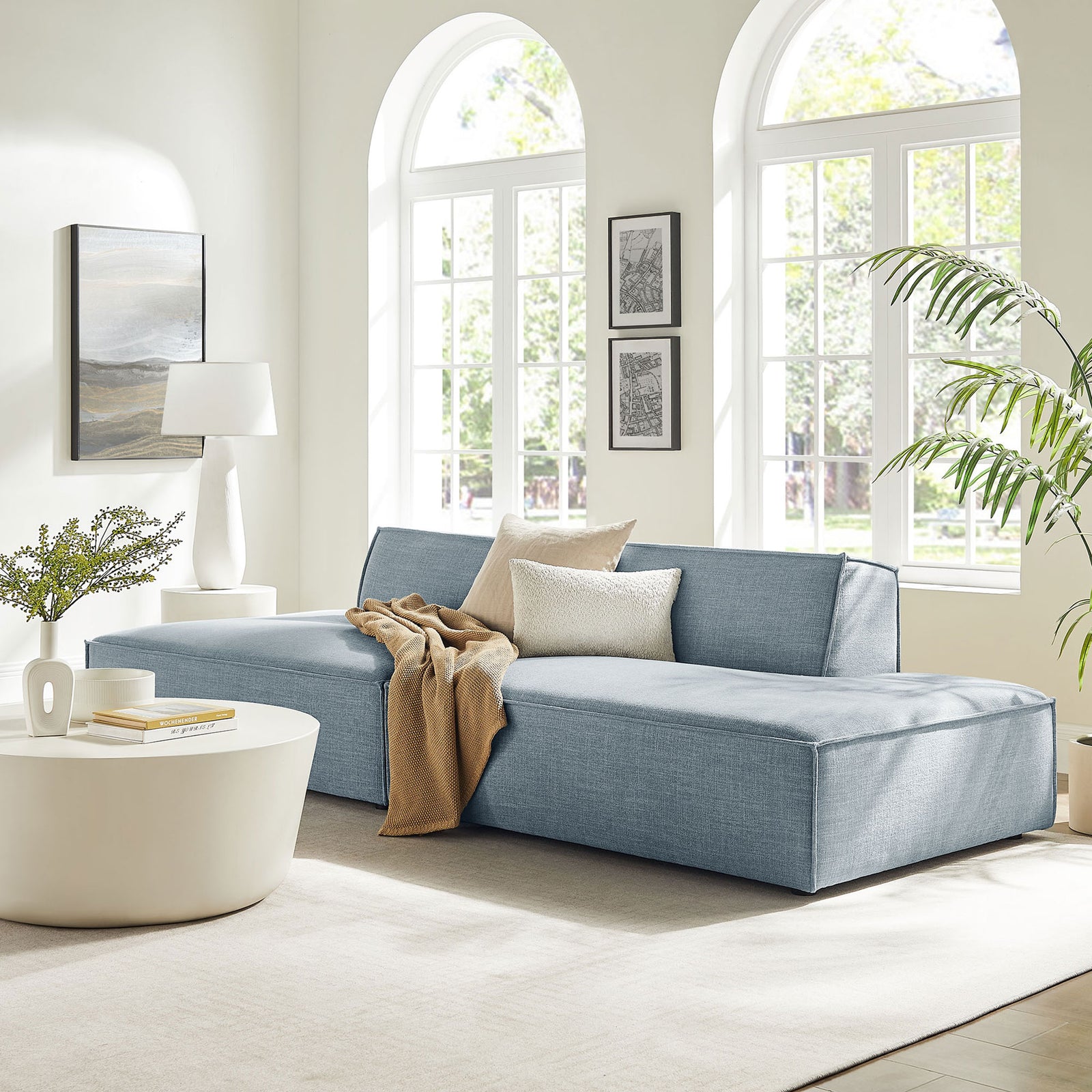 Sky blue modular loveseat creating a relaxed lounge-ready focal point in a bright living space || EEI-7423-SKY || front_angle_room