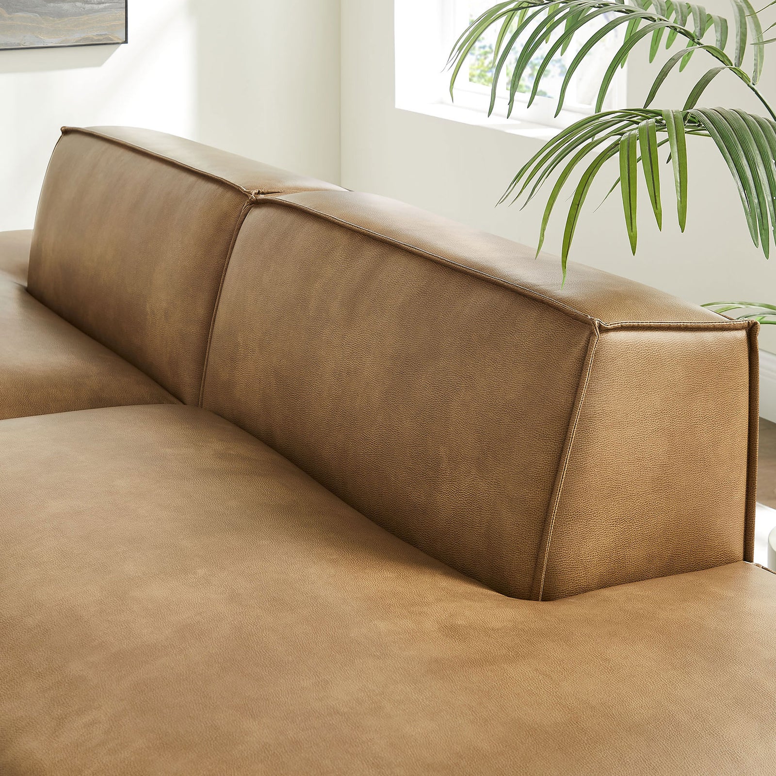 Streamlined back cushions with crisp tailoring highlight the loveseat's modern modular silhouette. || EEI-7424-TST || detail_room