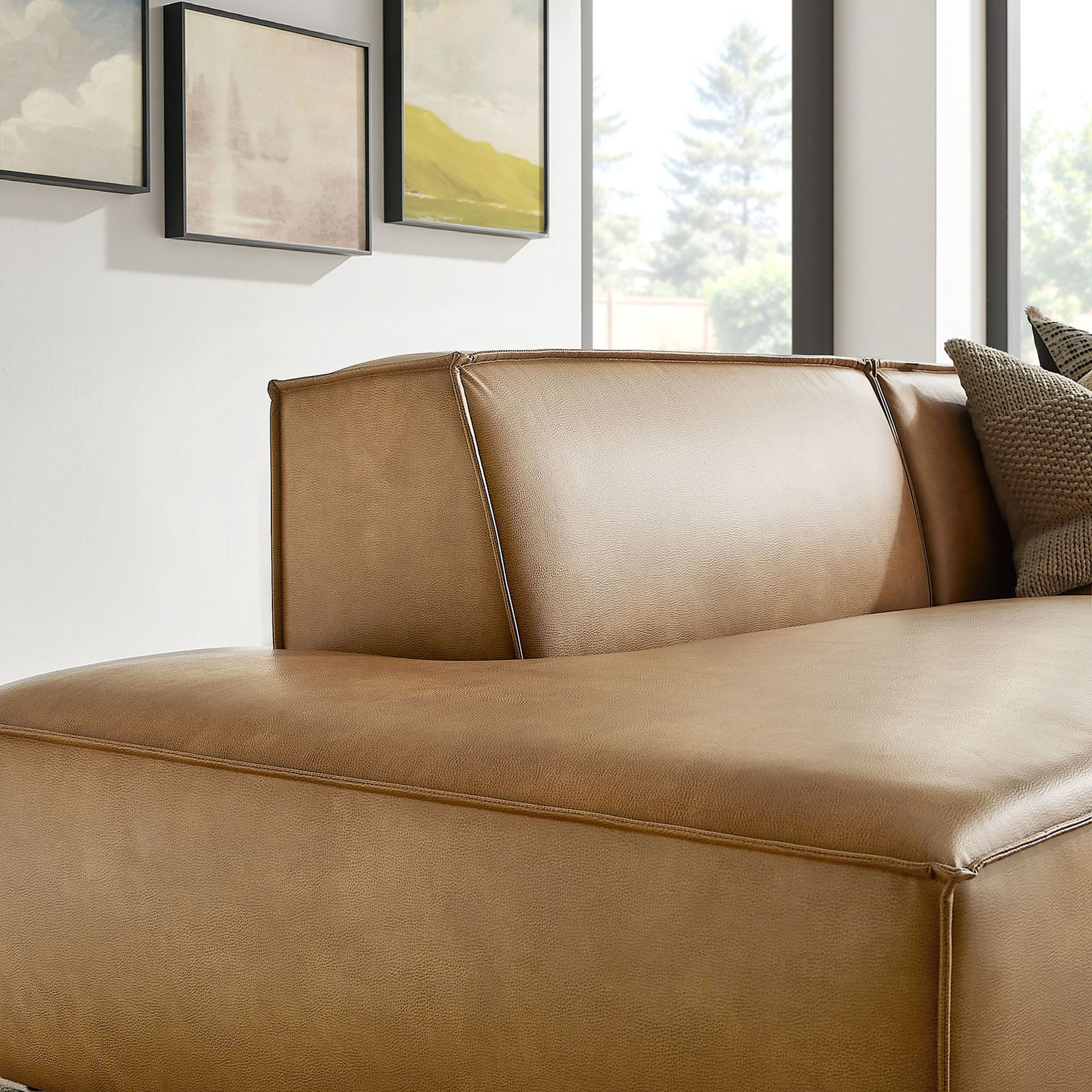 Chaise backrest highlighting the softly rounded cushions and smooth vegan leather. || EEI-7428-TST || detail_room