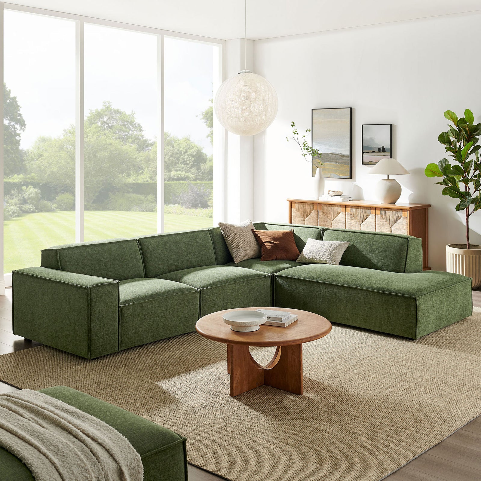 Restore foliage green modular sectional with right-facing chaise styled with round wood coffee table and neutral decor || EEI-7429-FOL || front_angle_room