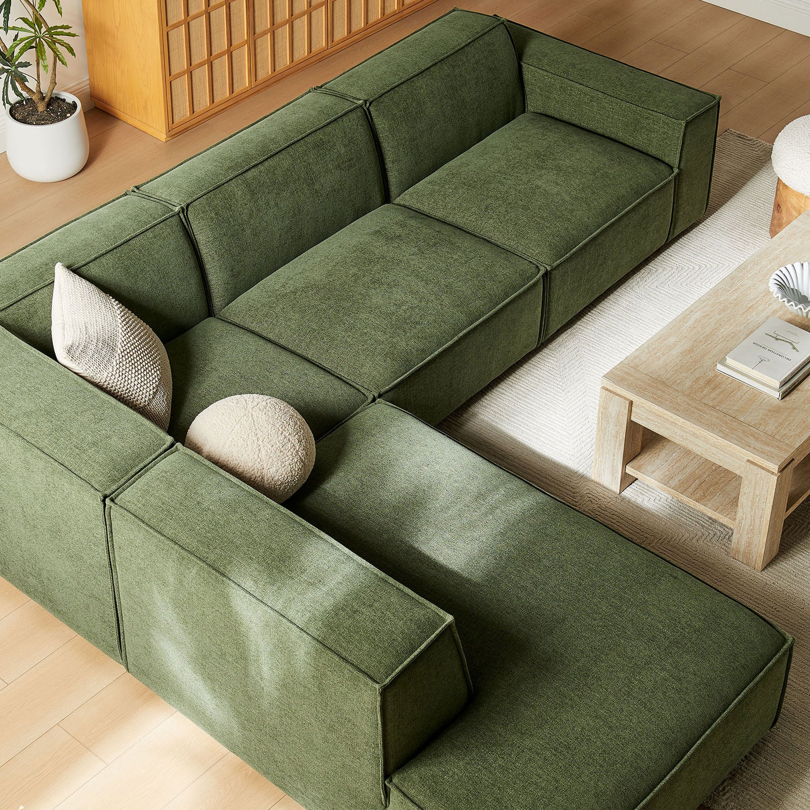 Create an inviting lounge with the Restore foliage green chaise sectional paired with a wood coffee table and soft rug || EEI-7431-FOL || top_angle_room