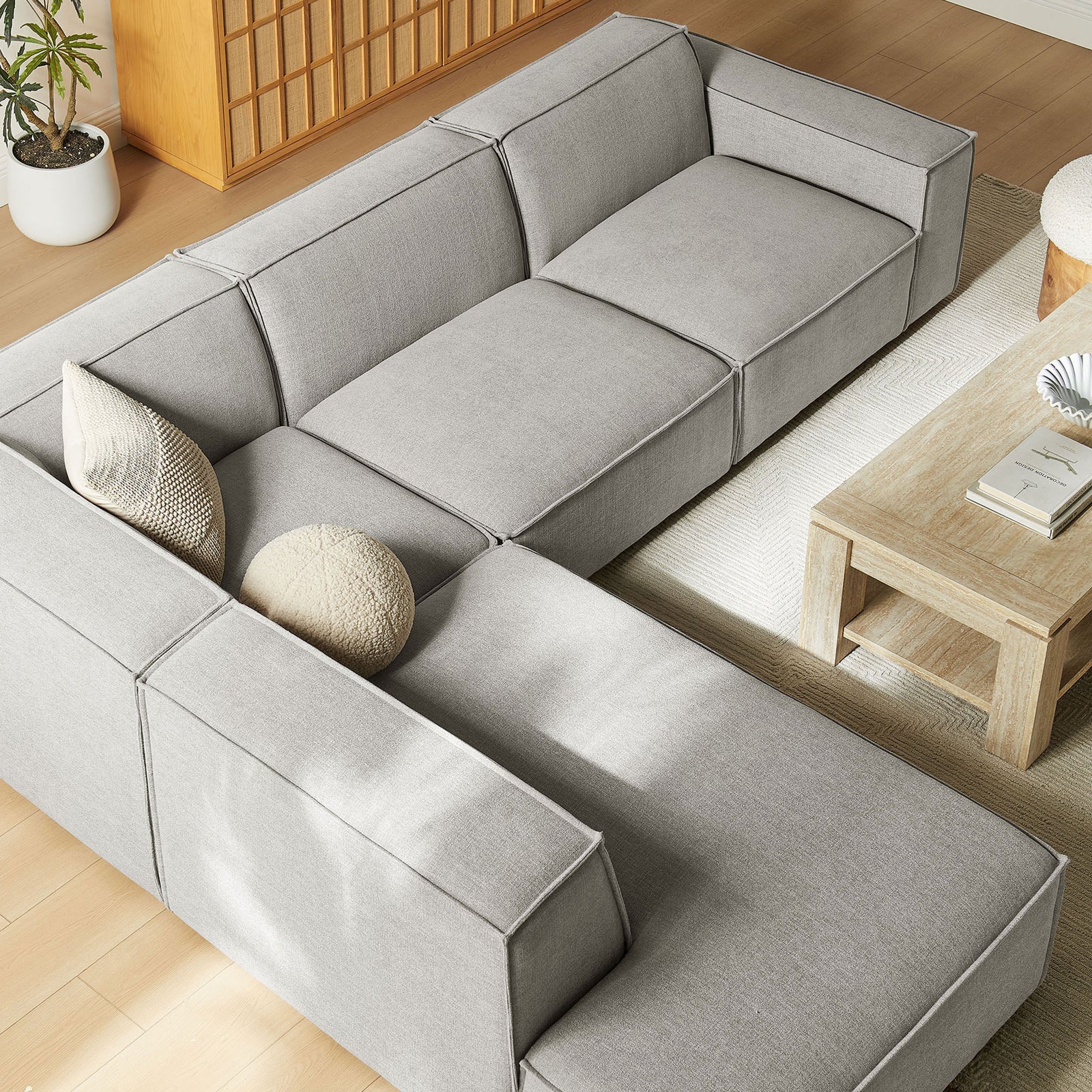 Deep modular seats and extra-wide chaise create a relaxed lounging spot on this pewter sectional || EEI-7431-PEW || top_angle_room