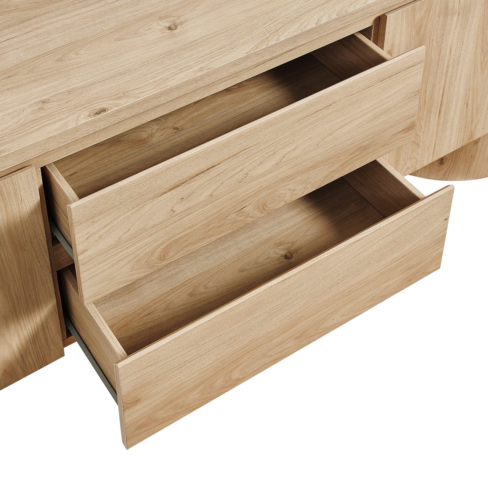 Two light oak drawers pulled open to show deep storage compartments for devices, games, and accessories || EEI-7440-LOA || storage_open_studio