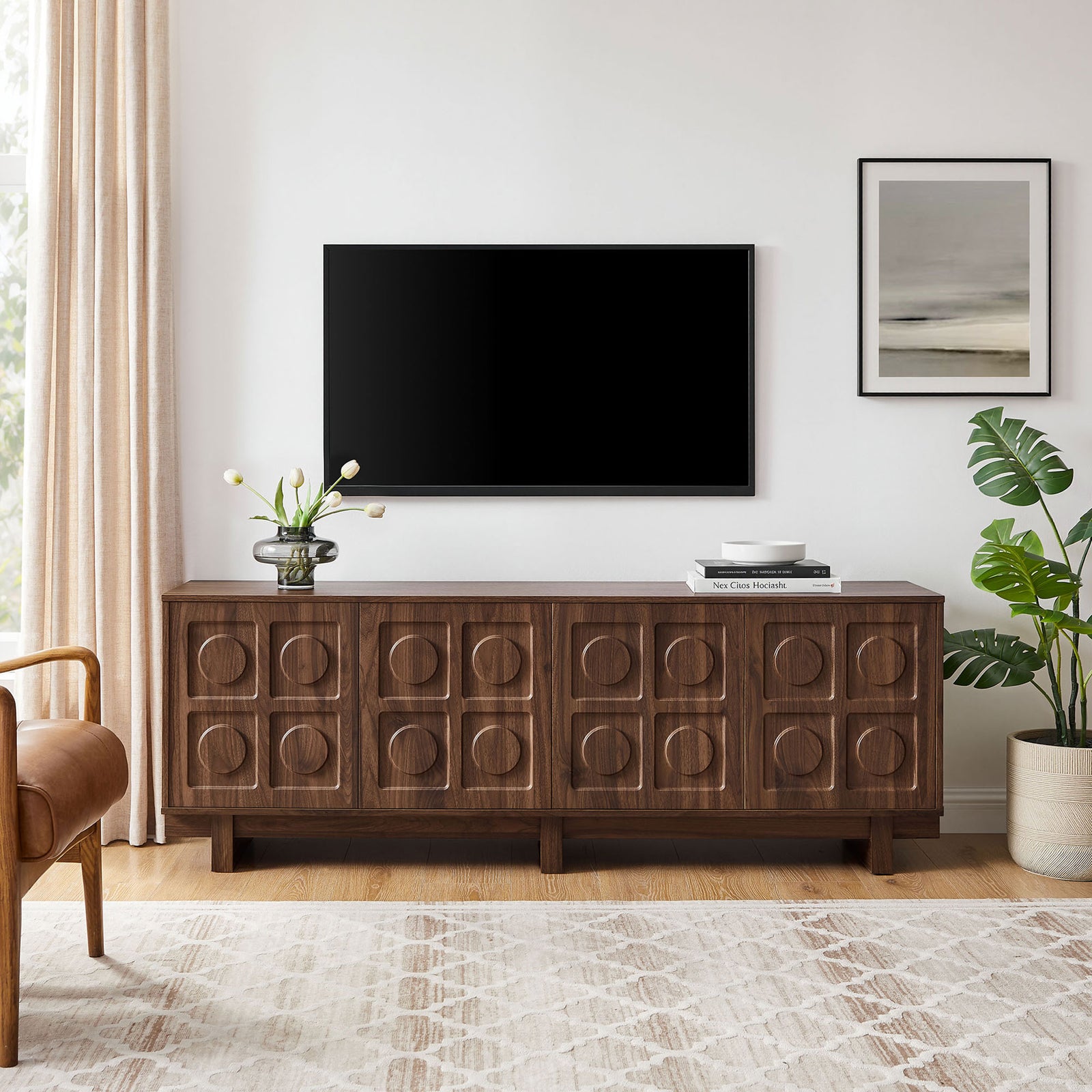 Walnut Knox TV stand beneath a wall mounted TV with coordinating rug, curtains, and greenery || EEI-7450-WAL || front_room