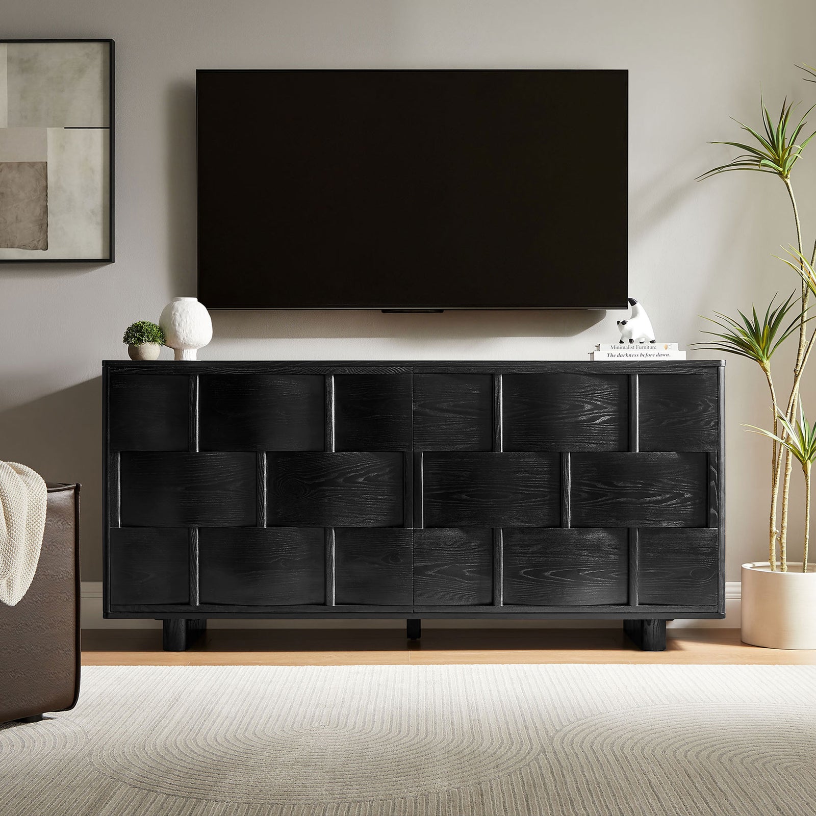 Black woven buffet cabinet used as a media console beneath a wall-mounted television || EEI-7452-BLK || front_room