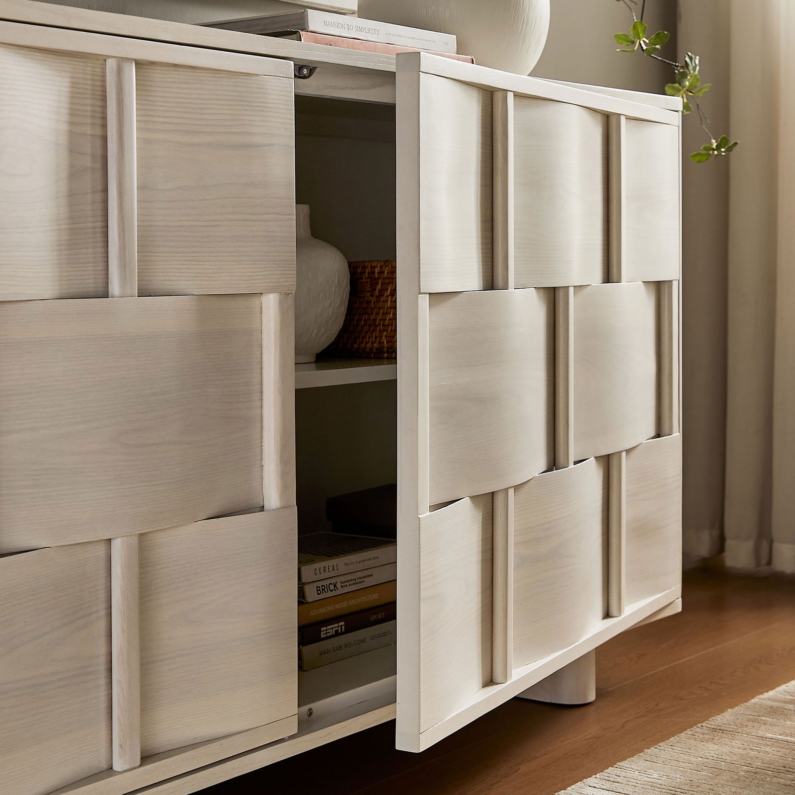 Buffet cabinet in use with door open, displaying styled shelves and woven-front texture in a living room || EEI-7452-WWA || storage_open_room