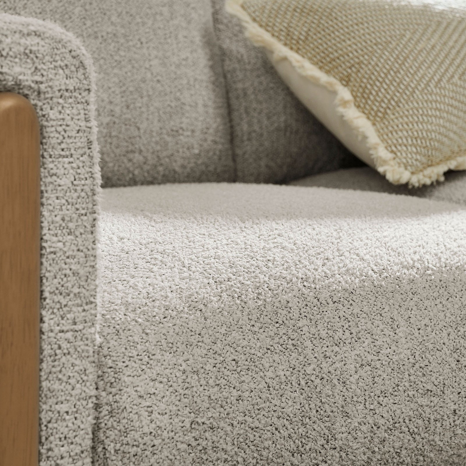Warm beech wood accent and boucle texture pair with a supportive seat for refined comfort || EEI-7459-PCH-BEE || detail_studio