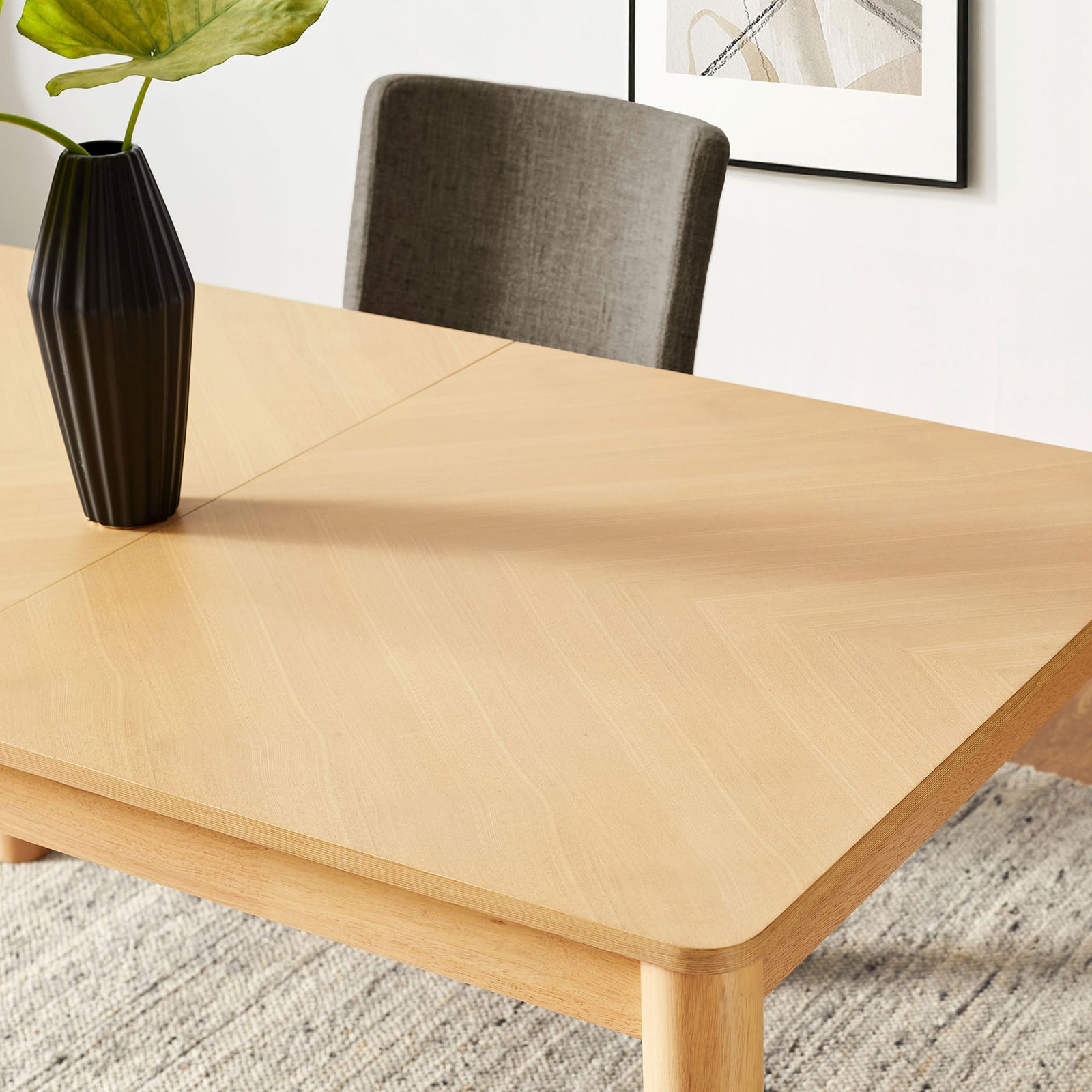 Chevron oak tabletop brings warm texture to the dining room, styled with contemporary decor accents. || EEI-7464-OAK || detail_room