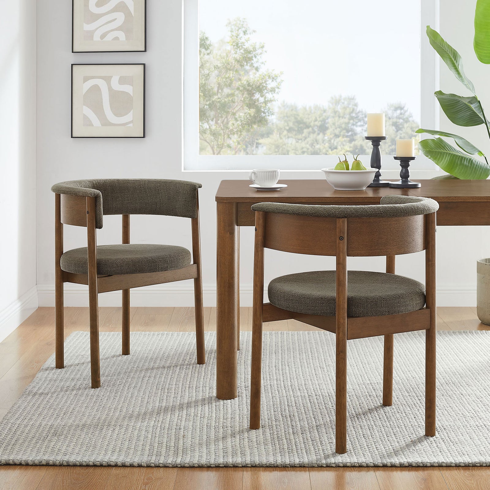 Set of two taupe curved dining chairs around a wood table in a modern airy dining room || EEI-7467-TAU || front_angle_multi_room