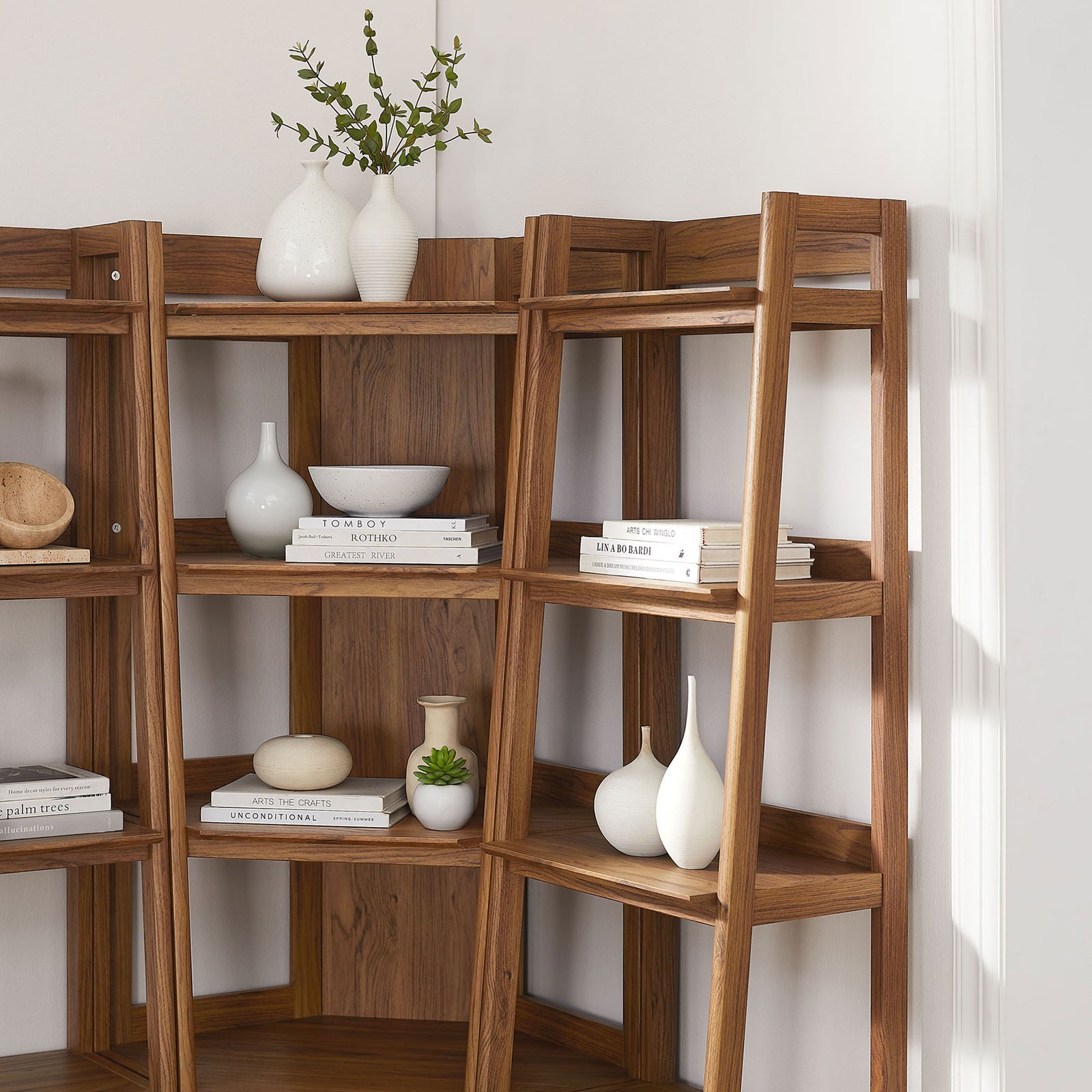 Styled shelves showcase decor and books, bringing warm texture to a light, modern corner || EEI-7470-WAL || detail_room