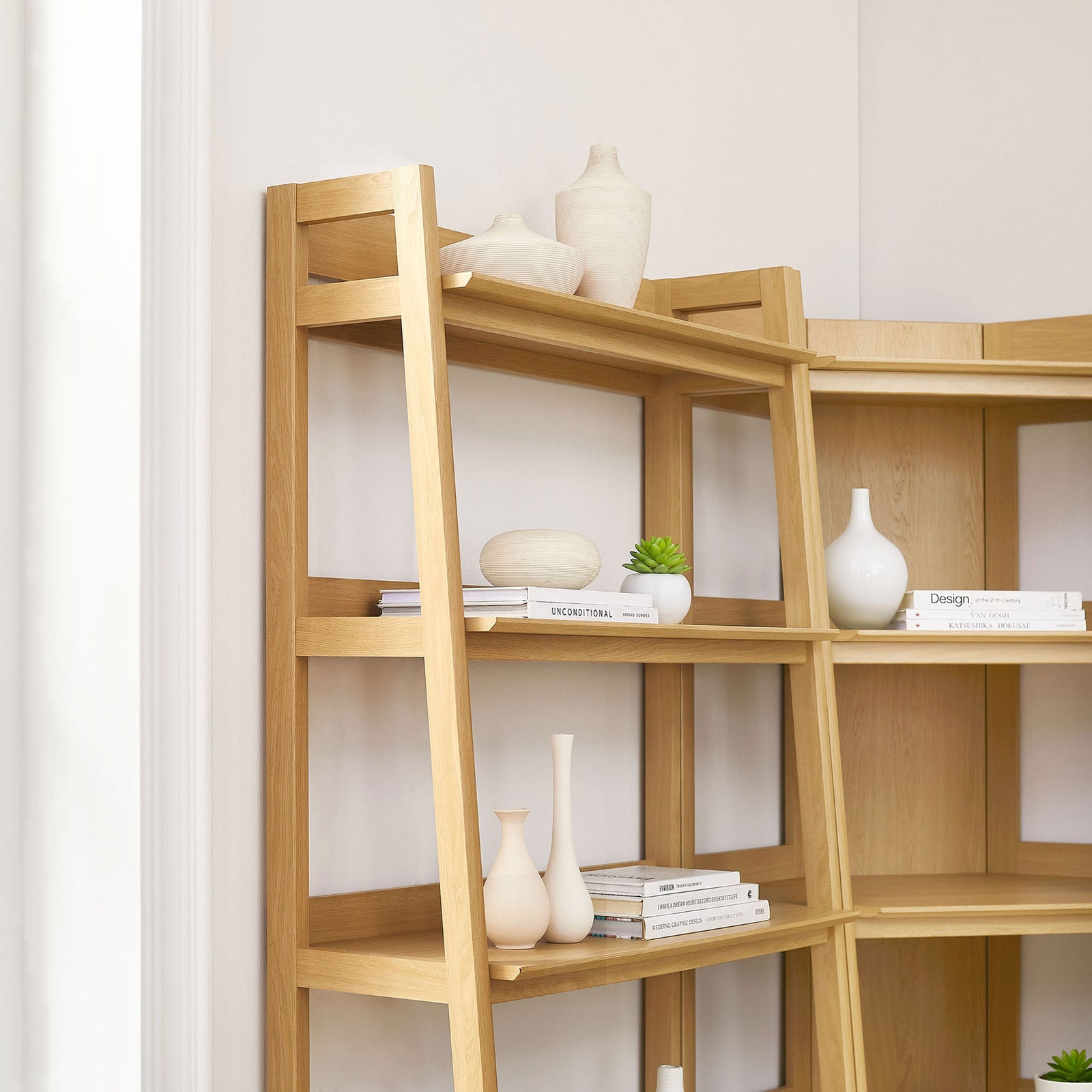 Open shelves and angled supports showcase decor beautifully in a bright, modern corner || EEI-7471-OAK || detail_room