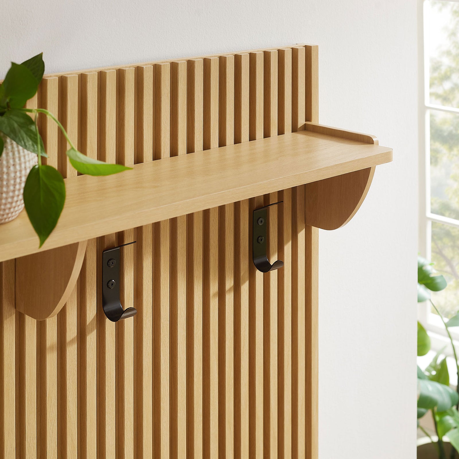 Shelf and hooks highlight the warm oak tone and refined vertical slat design || EEI-7472-OAK || storage_room