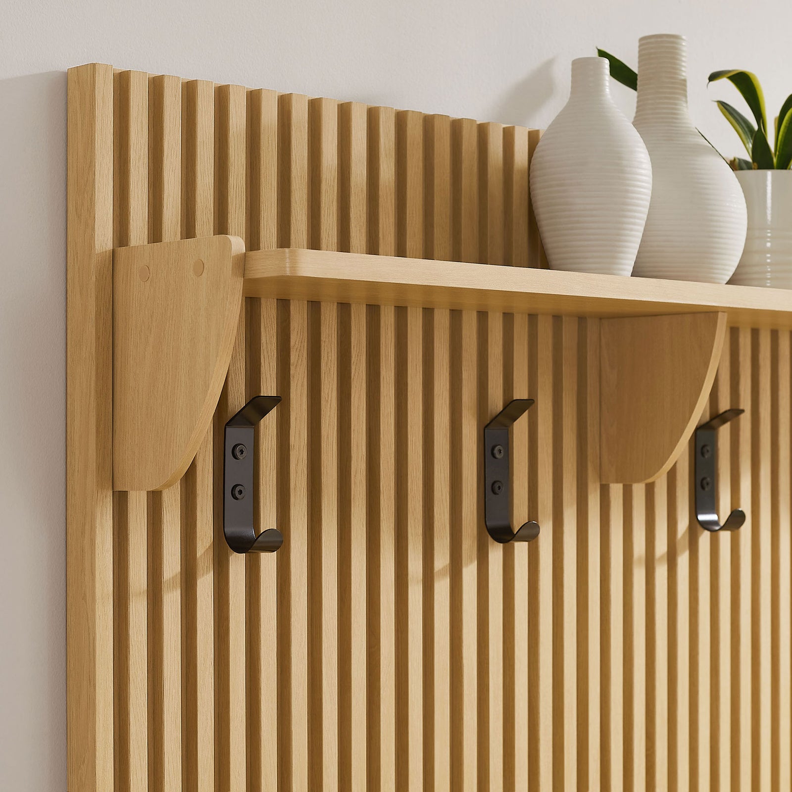 Black metal hooks and a sturdy shelf meet a slatted back for organized, grab-and-go entry storage. || EEI-7474-OAK || detail_room