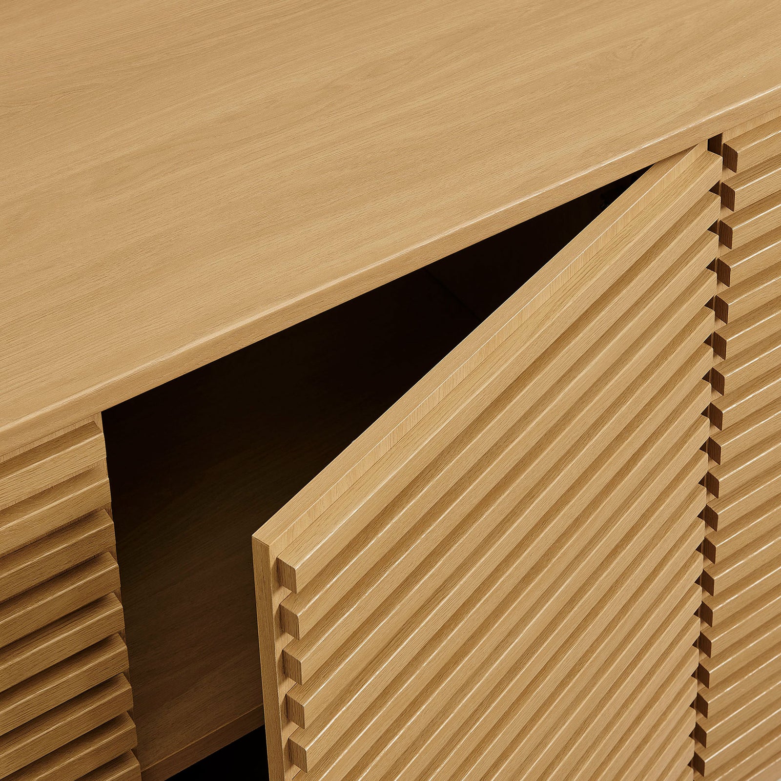 Slatted oak doors and seamless top surface highlight the cabinet's refined texture and craftsmanship || EEI-7477-OAK || detail_studio
