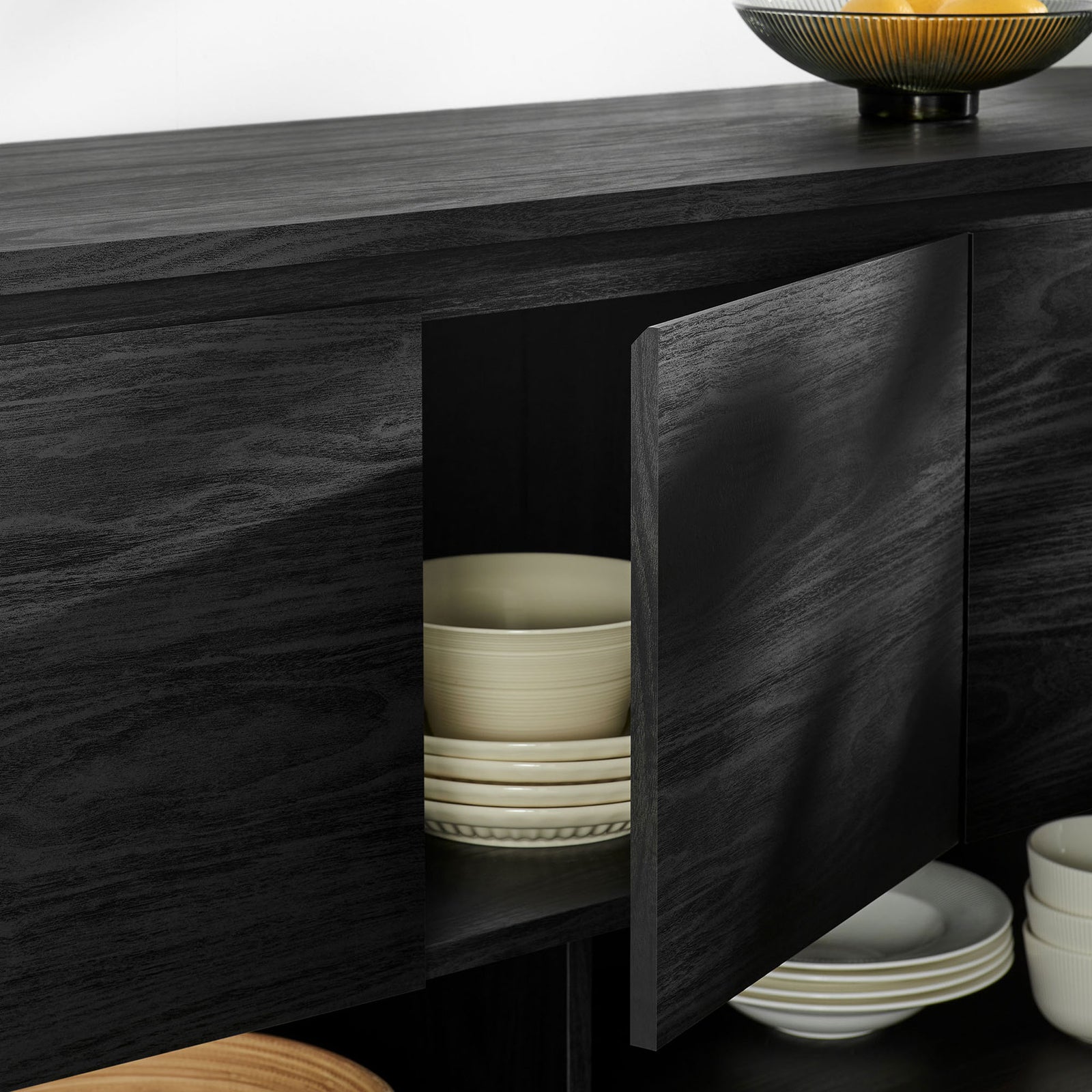 Duval sideboard door opening to reveal spacious shelving for neatly stacked bowls and everyday tableware || EEI-7478-BLK || storage_open_room
