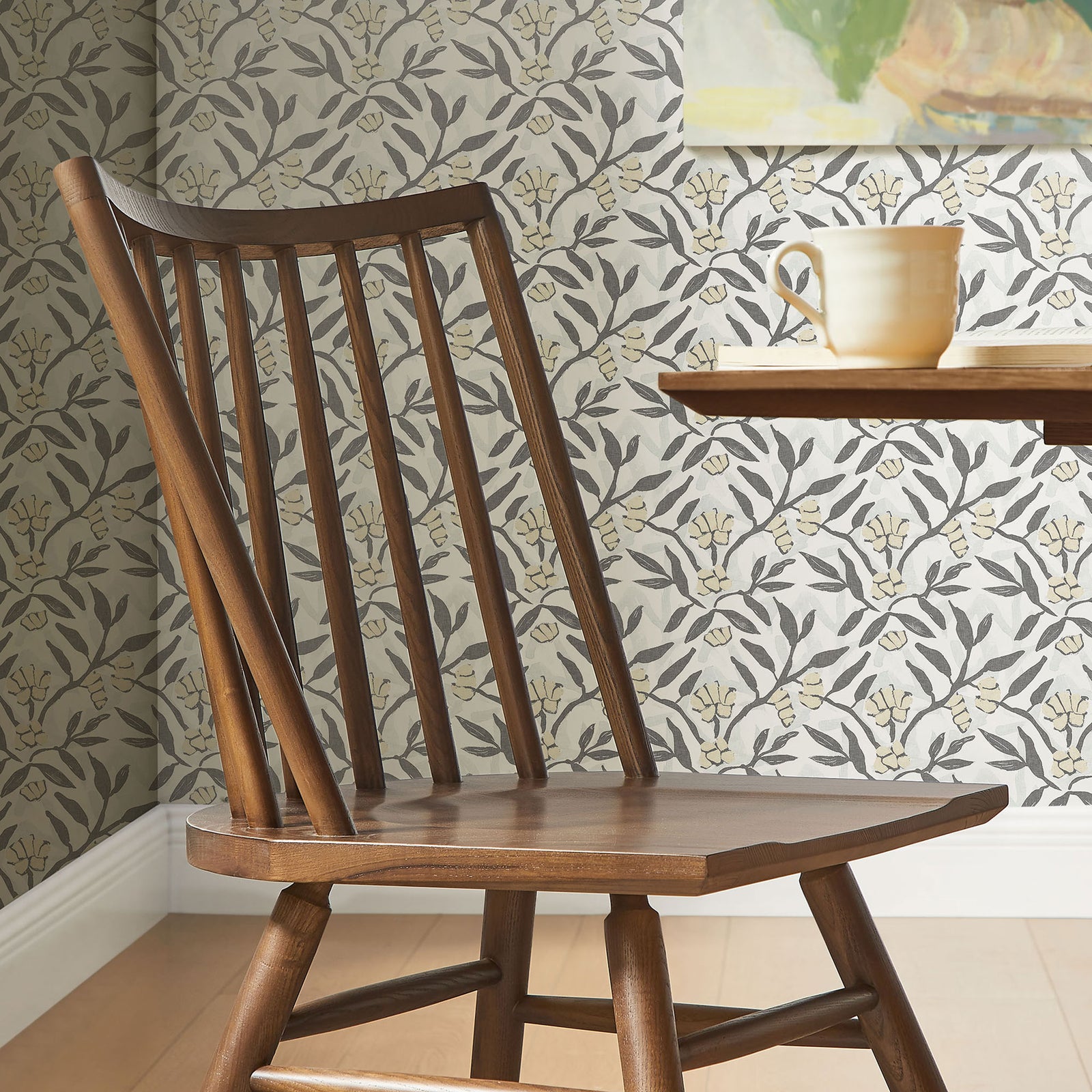 Spindle back walnut dining chair styled beside a round table in a light, patterned dining room || EEI-7482-WAL || detail_room