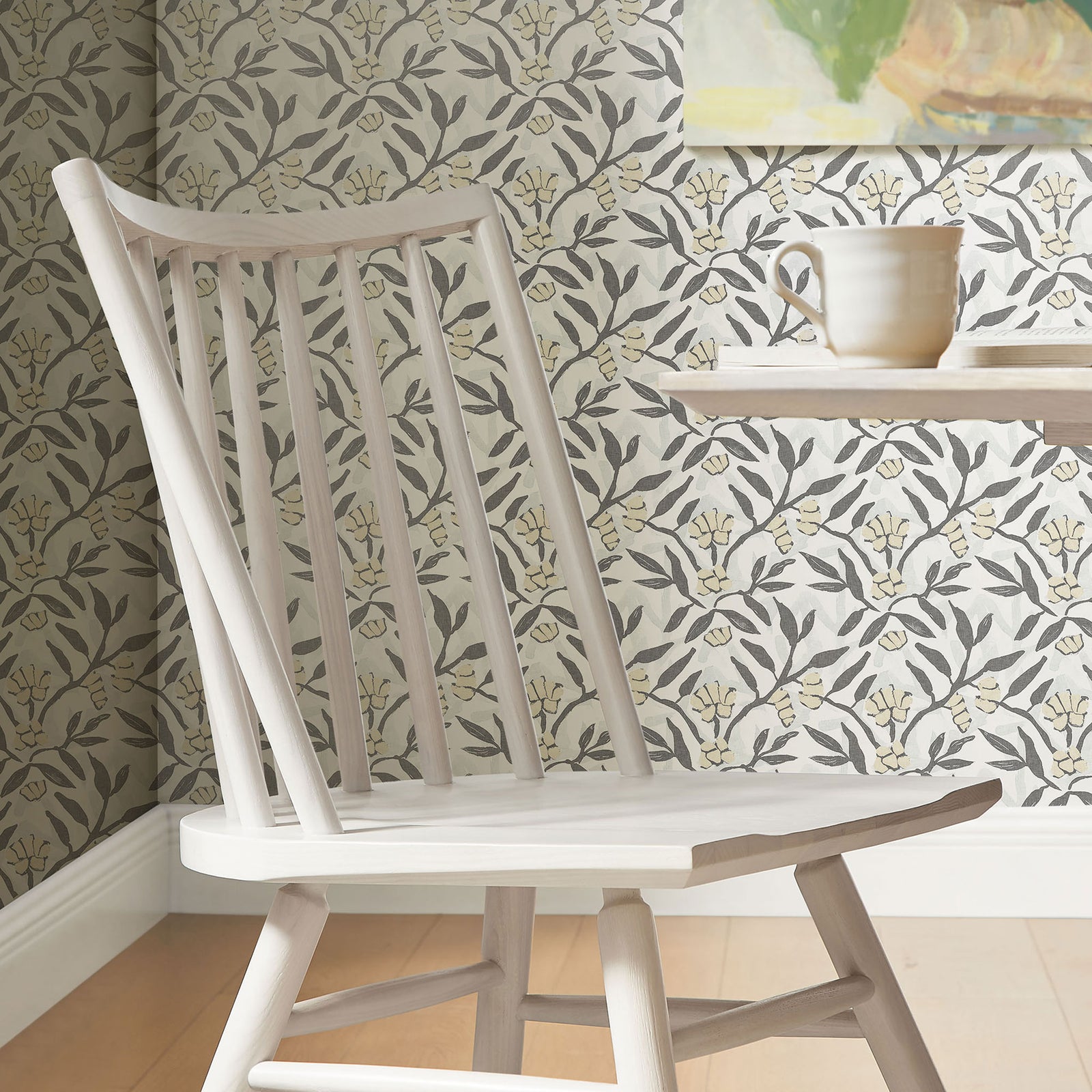 White wash dining chair beside a round table against patterned wallpaper || EEI-7482-WWA || detail_room