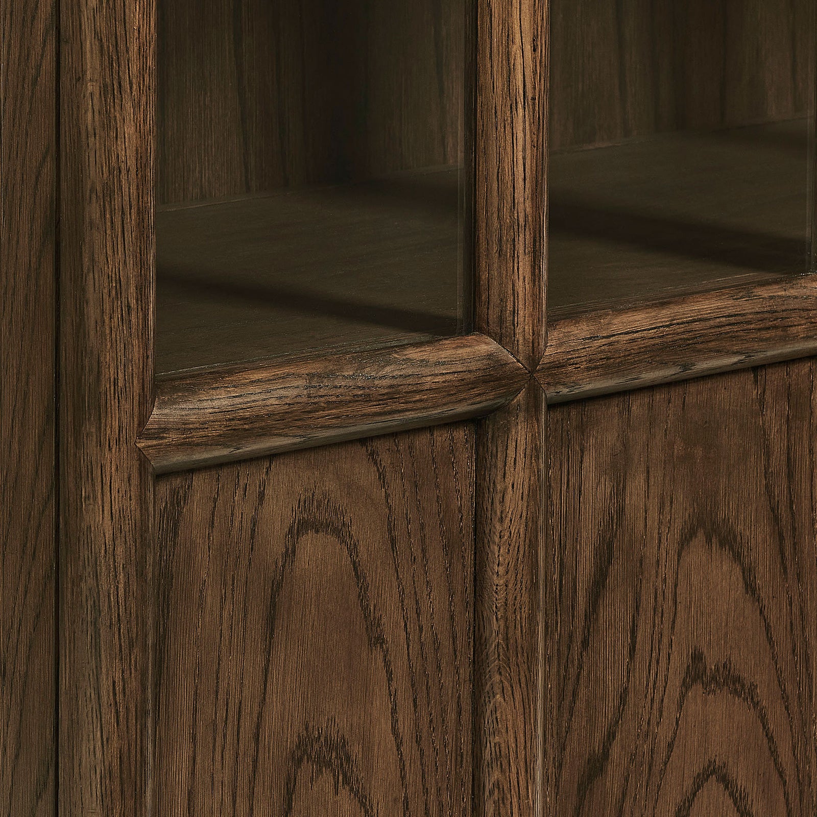 Walnut door framing with softly rounded mullions and expressive grain for a refined cabinet finish || EEI-7484-WAL || detail_studio