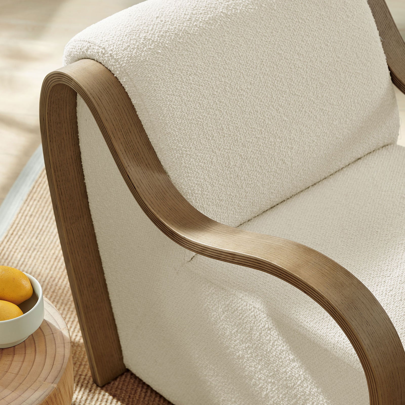 Boucle texture and contoured wood arm bring inviting warmth to the space || EEI-7490-CRE || detail_room