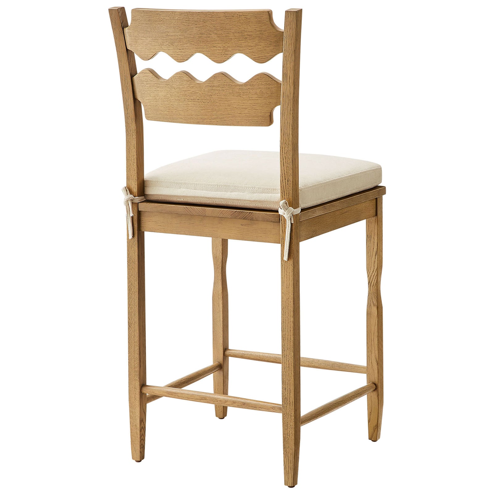 Distinctive wavy back slats and neatly tied cushion on a warm weathered oak frame || EEI-7518-WOA-LIN || back_angle_studio