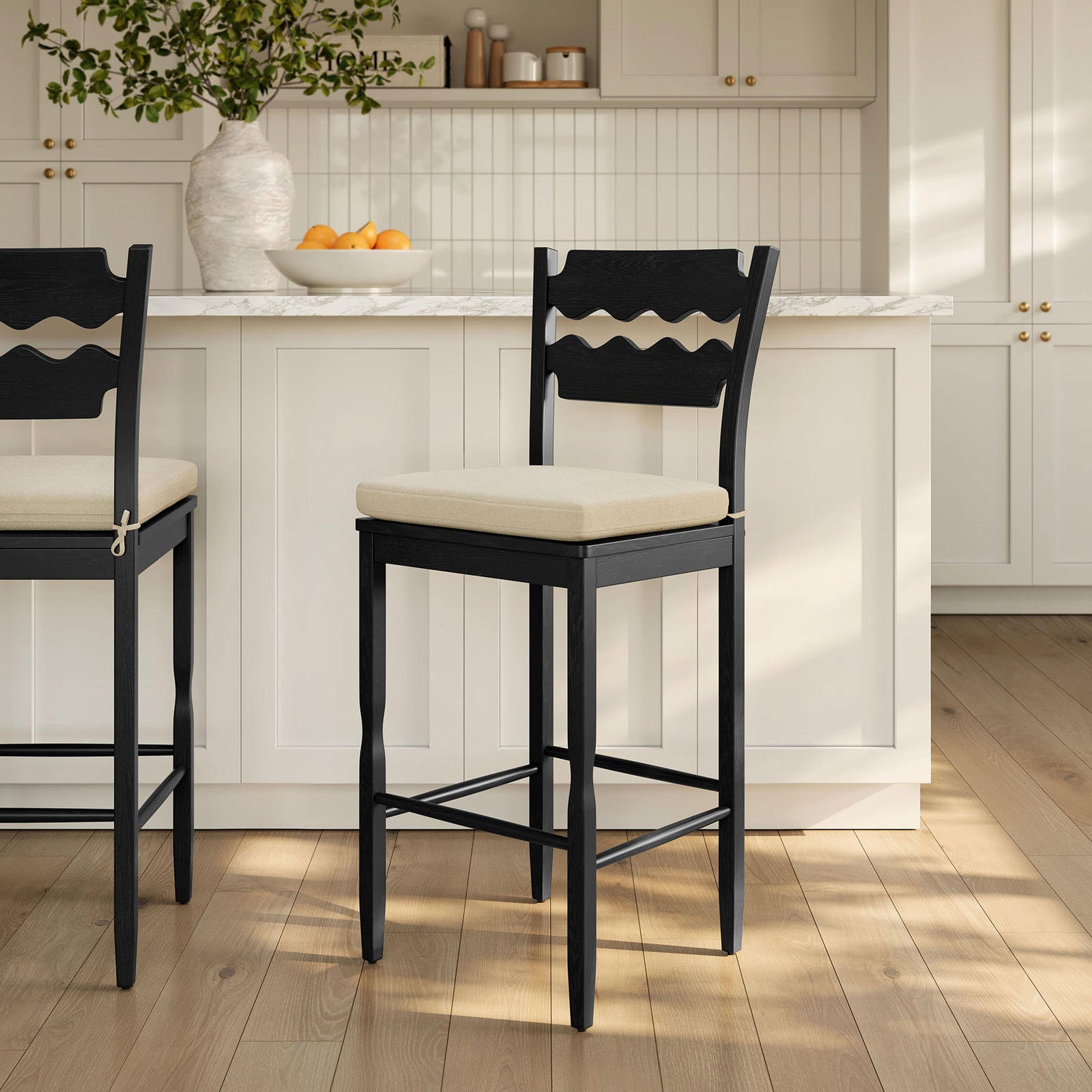 Bold, sculptural silhouette and comfortable cushion elevate bar seating in any space || EEI-7519-BLK-LIN || front_room