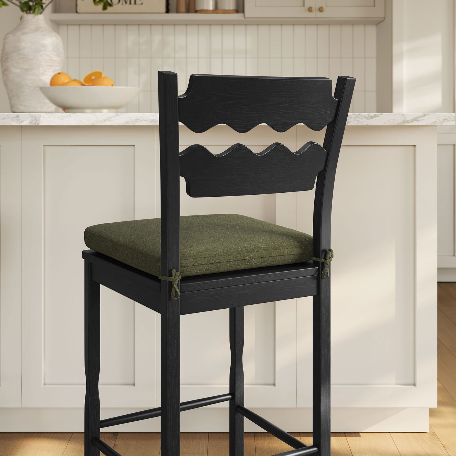 Wave-back detail and cushion ties bring artisanal charm to bar-height seating || EEI-7519-BLK-SGE || detail_room