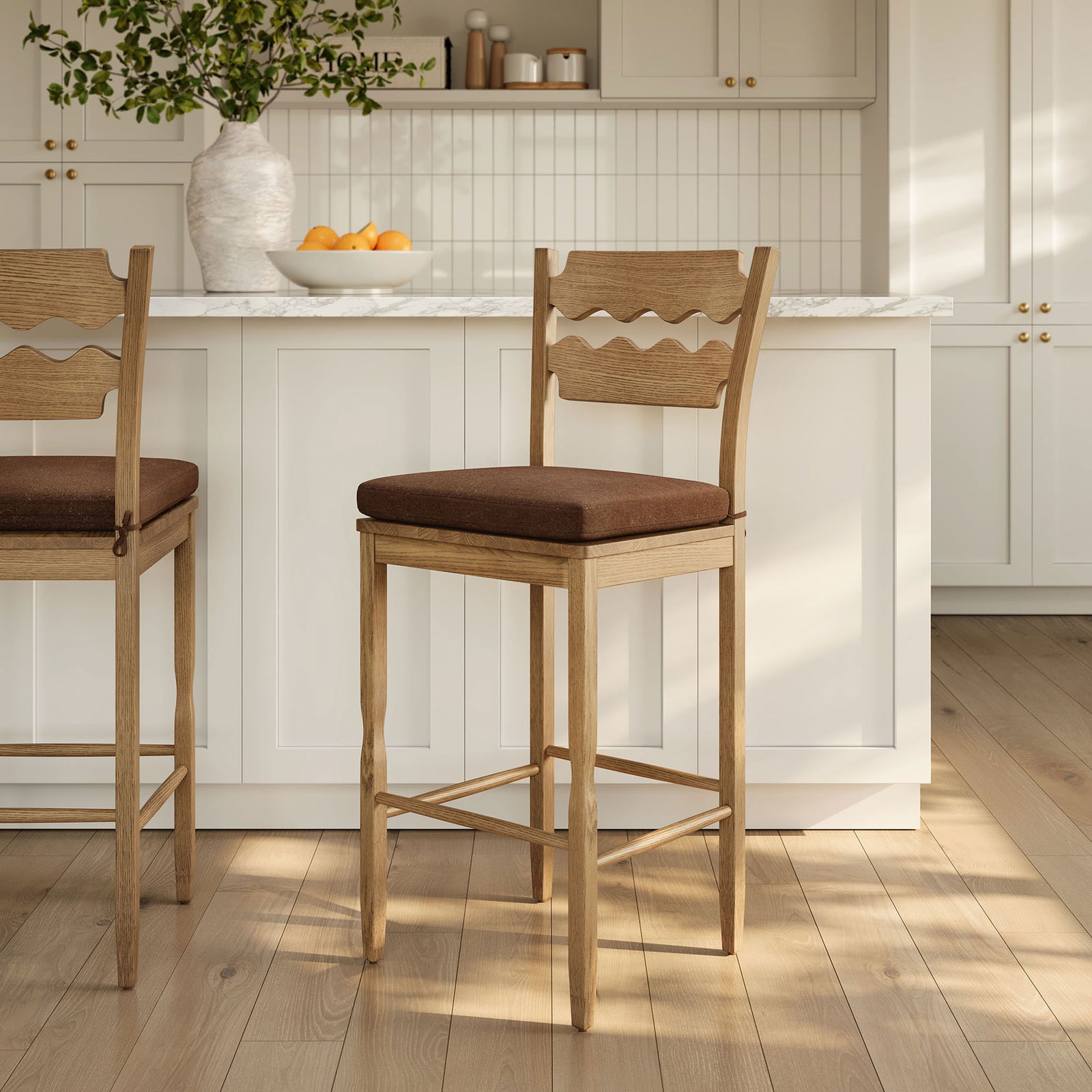 Inviting bar stools add warmth to the kitchen with organic oak texture and cocoa seats || EEI-7519-WOA-COA || front_angle_room