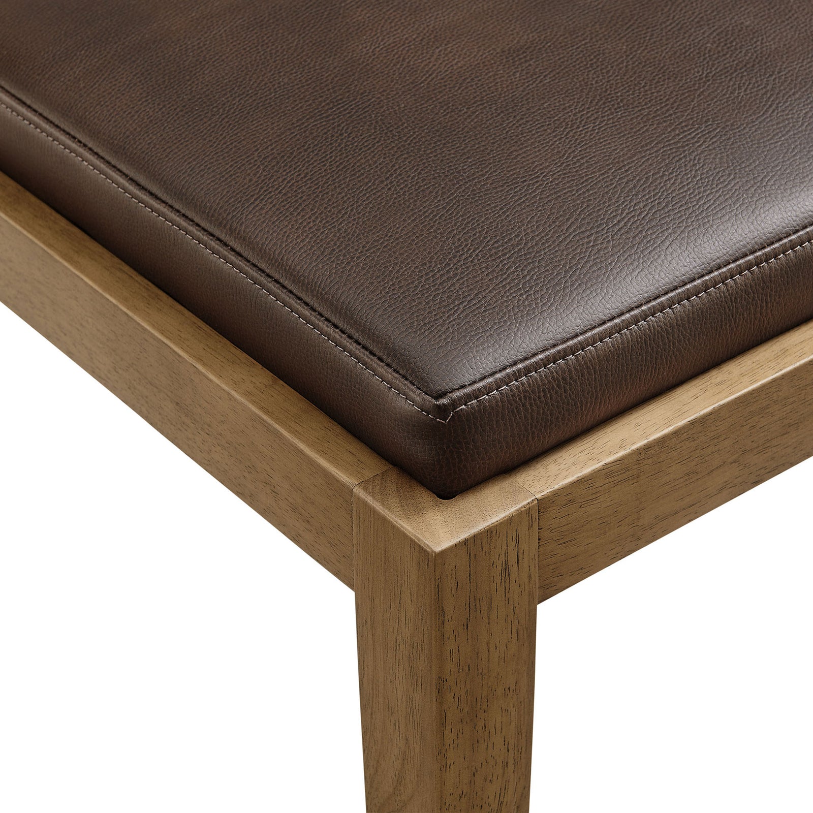 Espresso vegan leather seat cushion with tailored piping resting on a precisely joined natural wood frame corner || EEI-7527-ESP || detail_studio