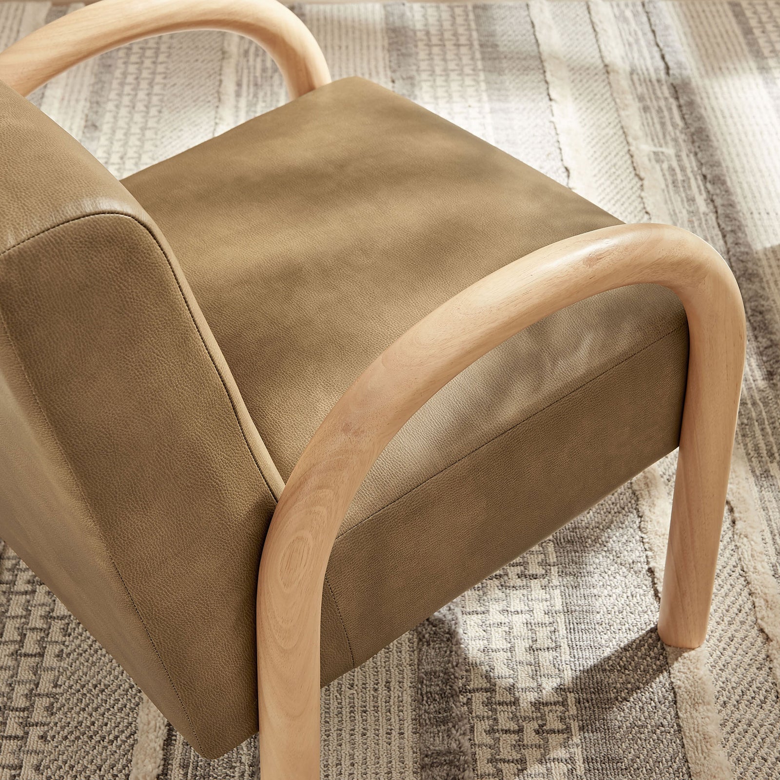Softly rounded edges and tactile upholstery elevate cozy corners with natural wood warmth. || EEI-7530-TST || detail_room