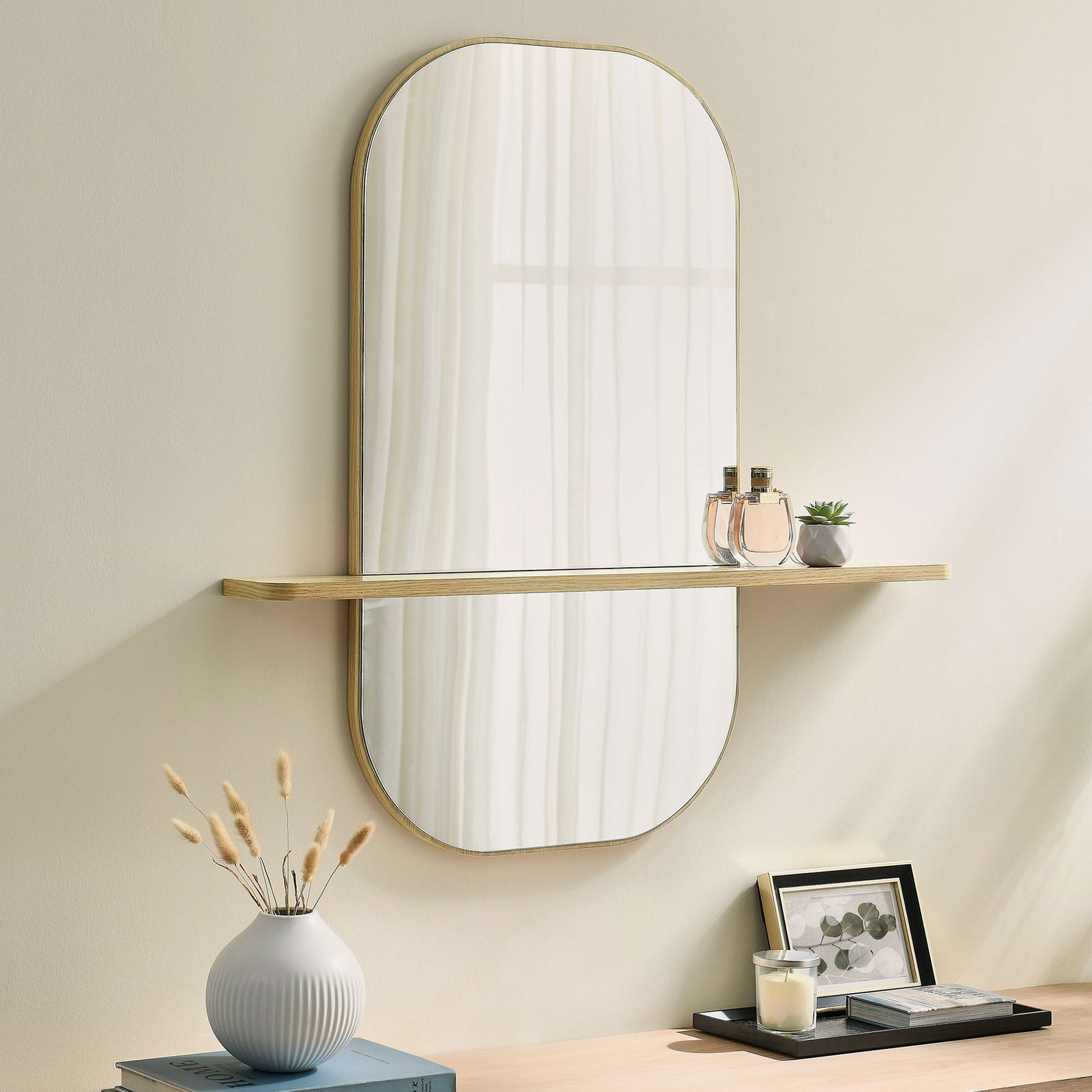 Large oak wall mirror with shelf styled above a console table for airy, modern spaces. || EEI-7533-OAK || front_angle_room