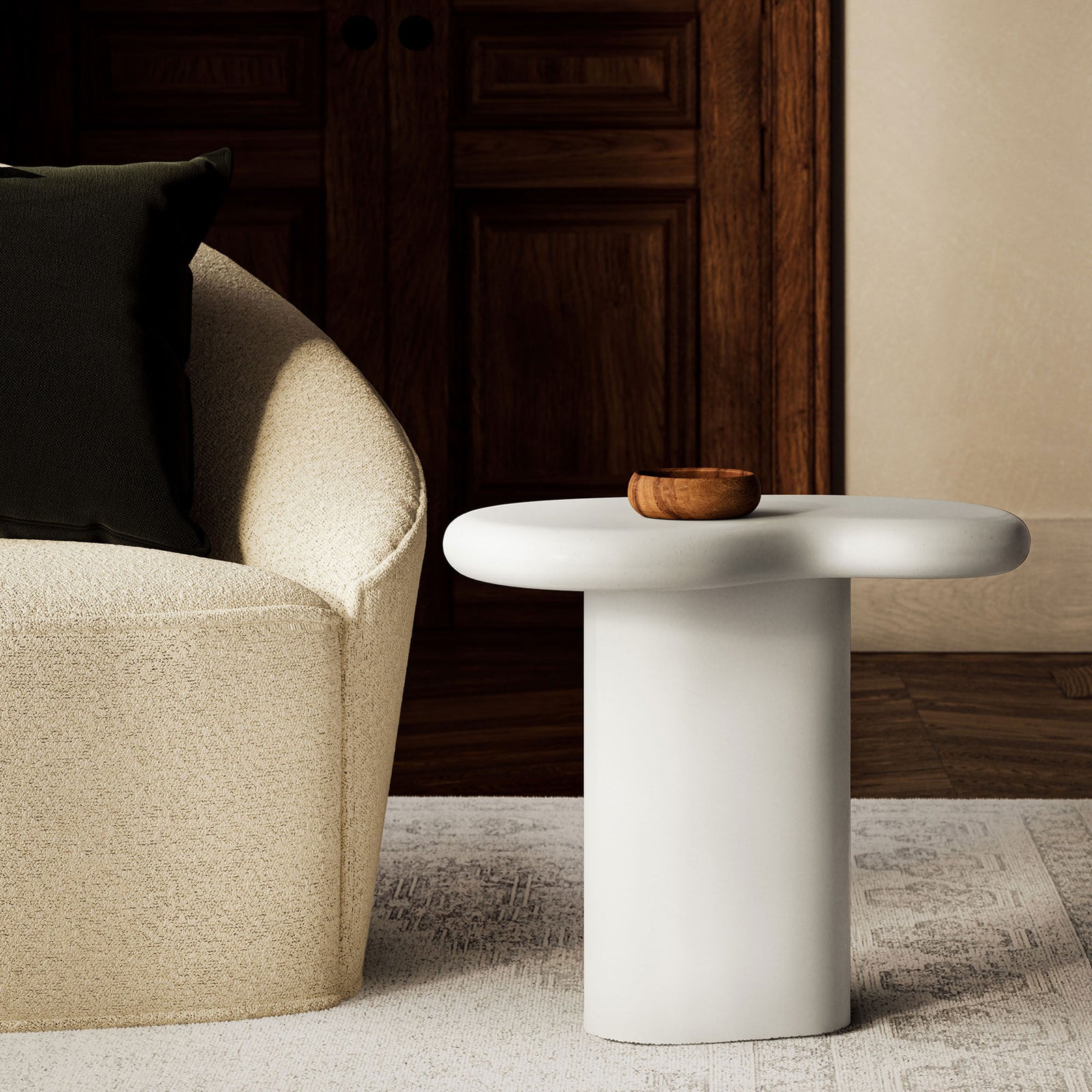 White concrete side table styled in a warm living room beside a boucle chair and neutral area rug || EEI-7535-WHI || front_angle_room