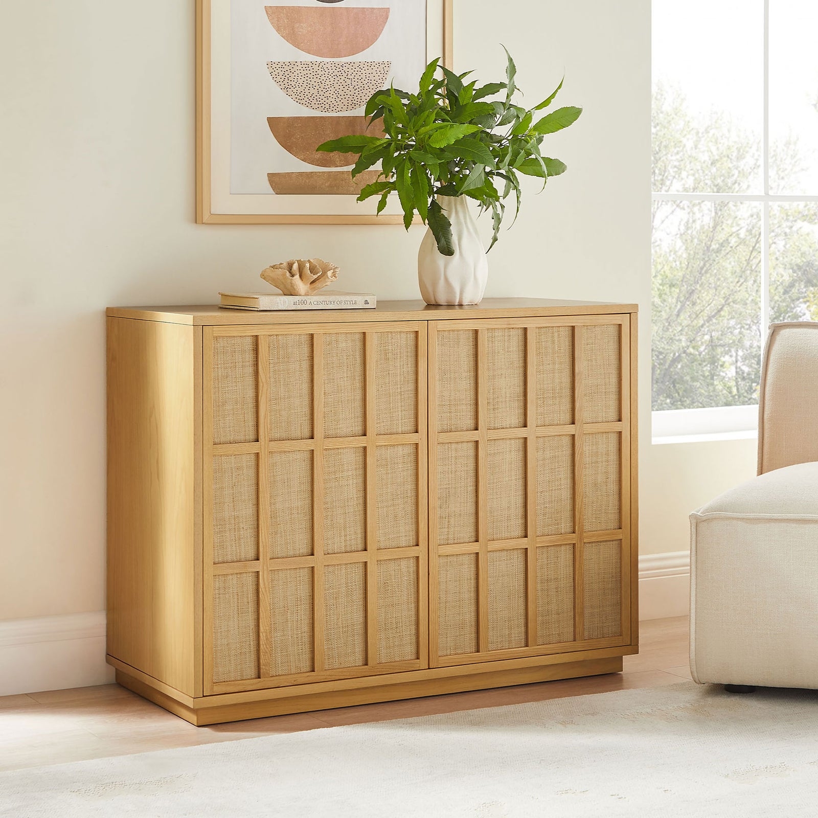 Japandi accent cabinet styled in a serene living room with art, greenery, and soft neutral tones || EEI-7558-LOA || front_angle_room