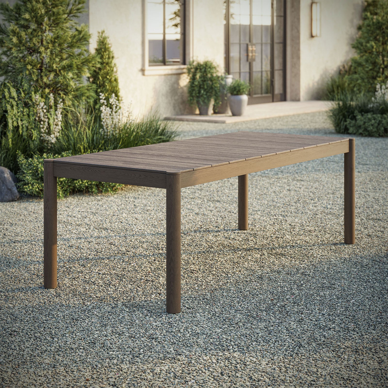 Eleni 89 inch weathered gray teak outdoor dining table centered on a patio ready for lively gatherings || EEI-7562-WGR || front_angle_room