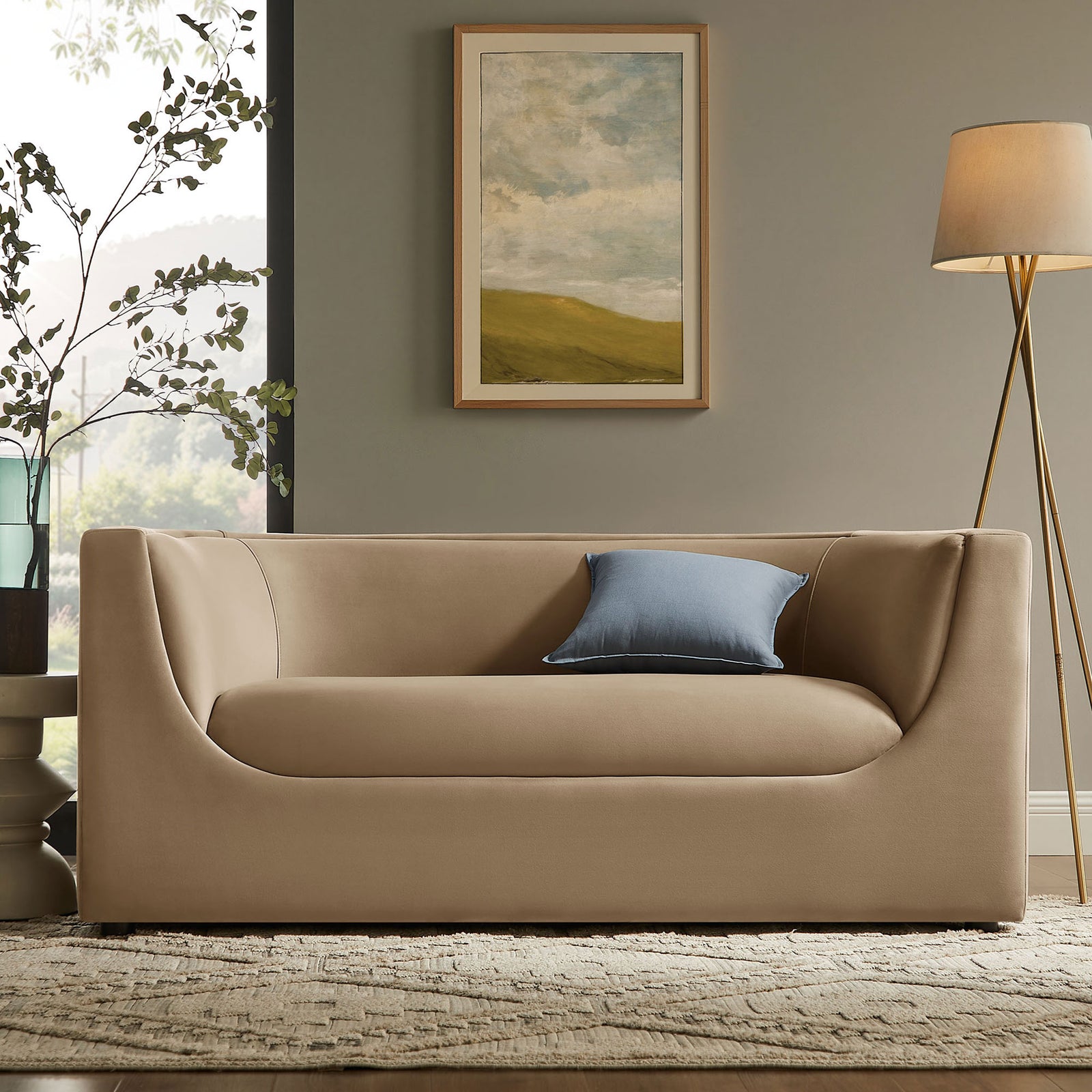 Taupe velvet loveseat styled in a modern living room with blue accent pillow and brass floor lamp || EEI-7565-TAU || front_room