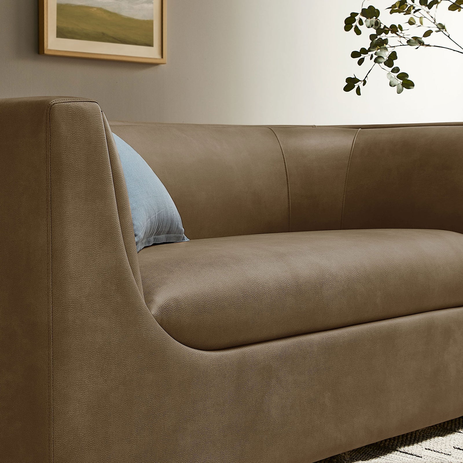 Curved back and plush seat cushion create an inviting lounge spot on this mushroom loveseat || EEI-7568-MUS || detail_room