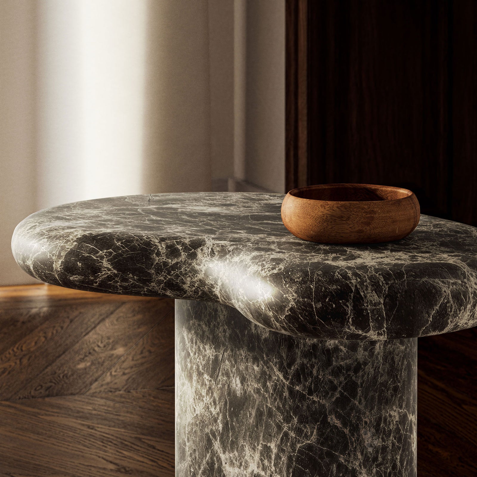 A faux marble tabletop in a moody interior, styled with a wooden bowl for a rich layered look || EEI-7572-EMP || detail_room