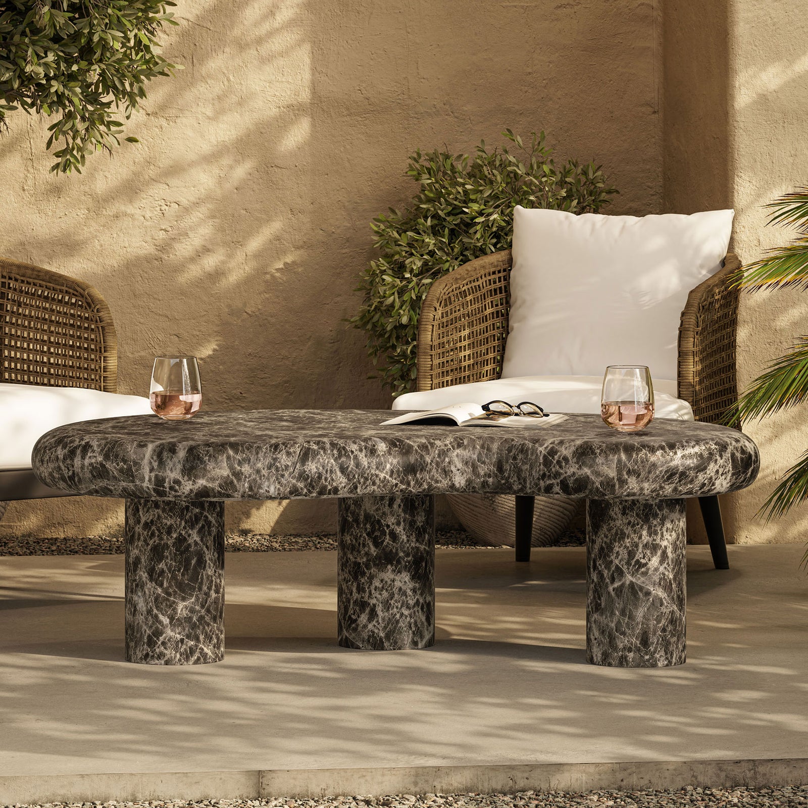 Sculptural faux marble coffee table creates a dramatic focal point on the patio for drinks and casual gatherings || EEI-7573-EMP || front_room
