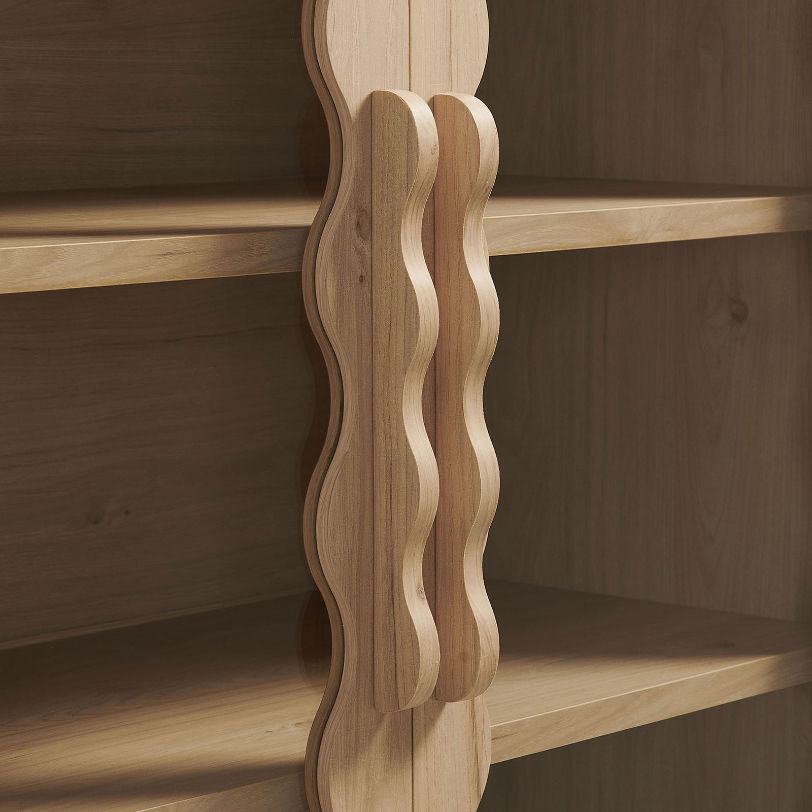 Sculpted wavy cabinet handles in a matching light oak finish || EEI-7589-LOA || handle_studio