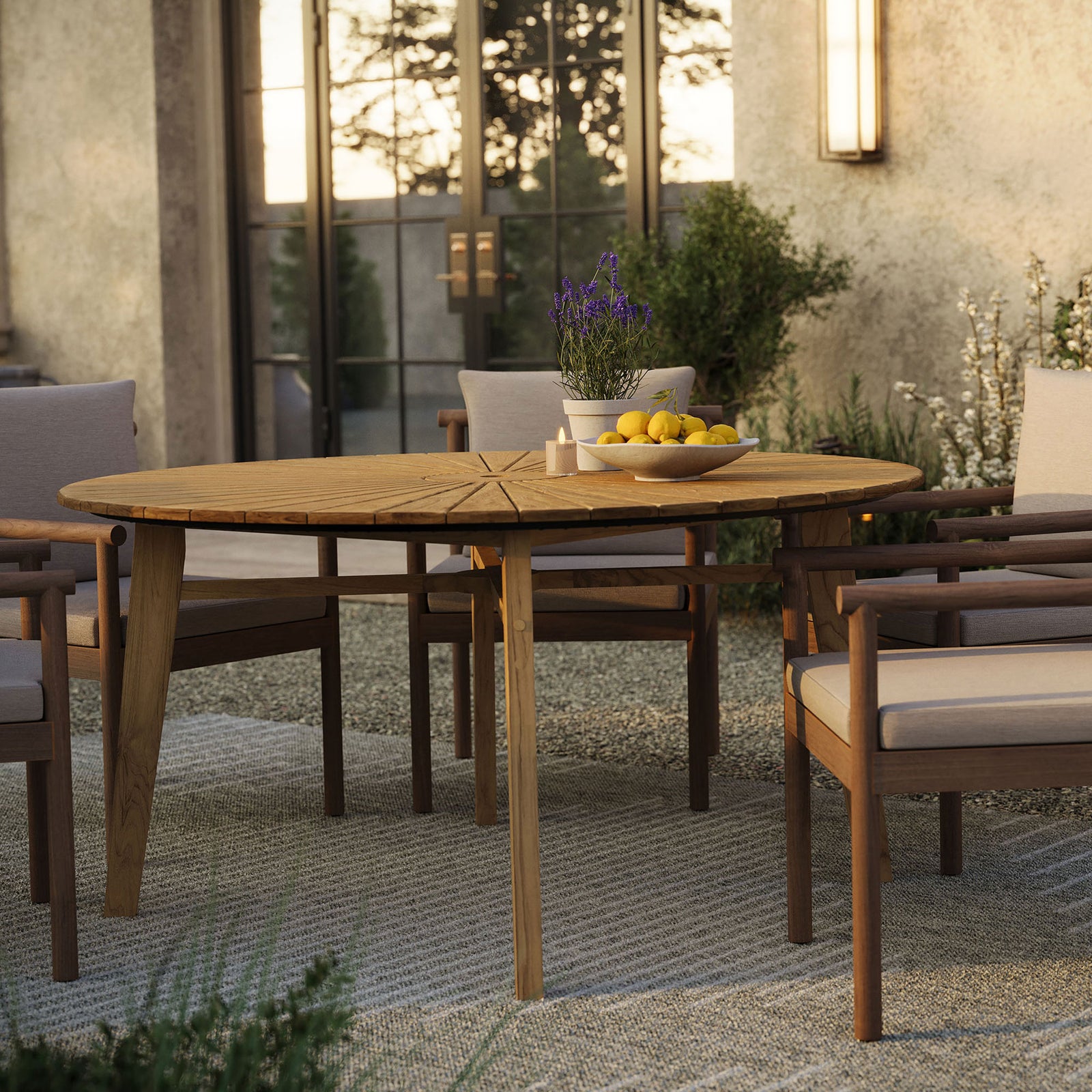 Teak sunburst dining tabletop styled with cushioned seating and a bowl of lemons on an outdoor patio || EEI-7601-NAT || detail_room