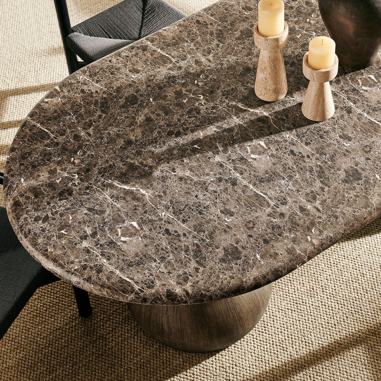 Styled tabletop vignette highlighting the dark marble-look finish and rounded waterfall edge || EEI-7623-EMP || detail_room