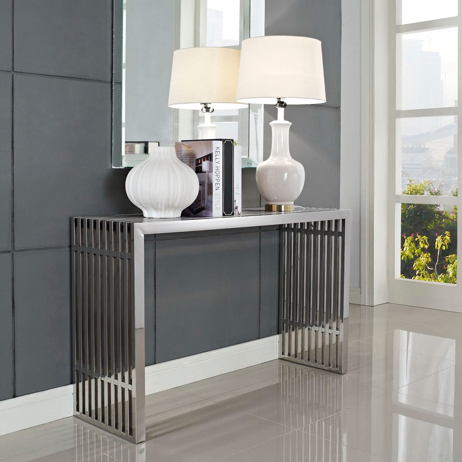 Gleaming stainless steel console with striking grid silhouette and crisp modern lines || EEI-779-SLV || front_angle_room