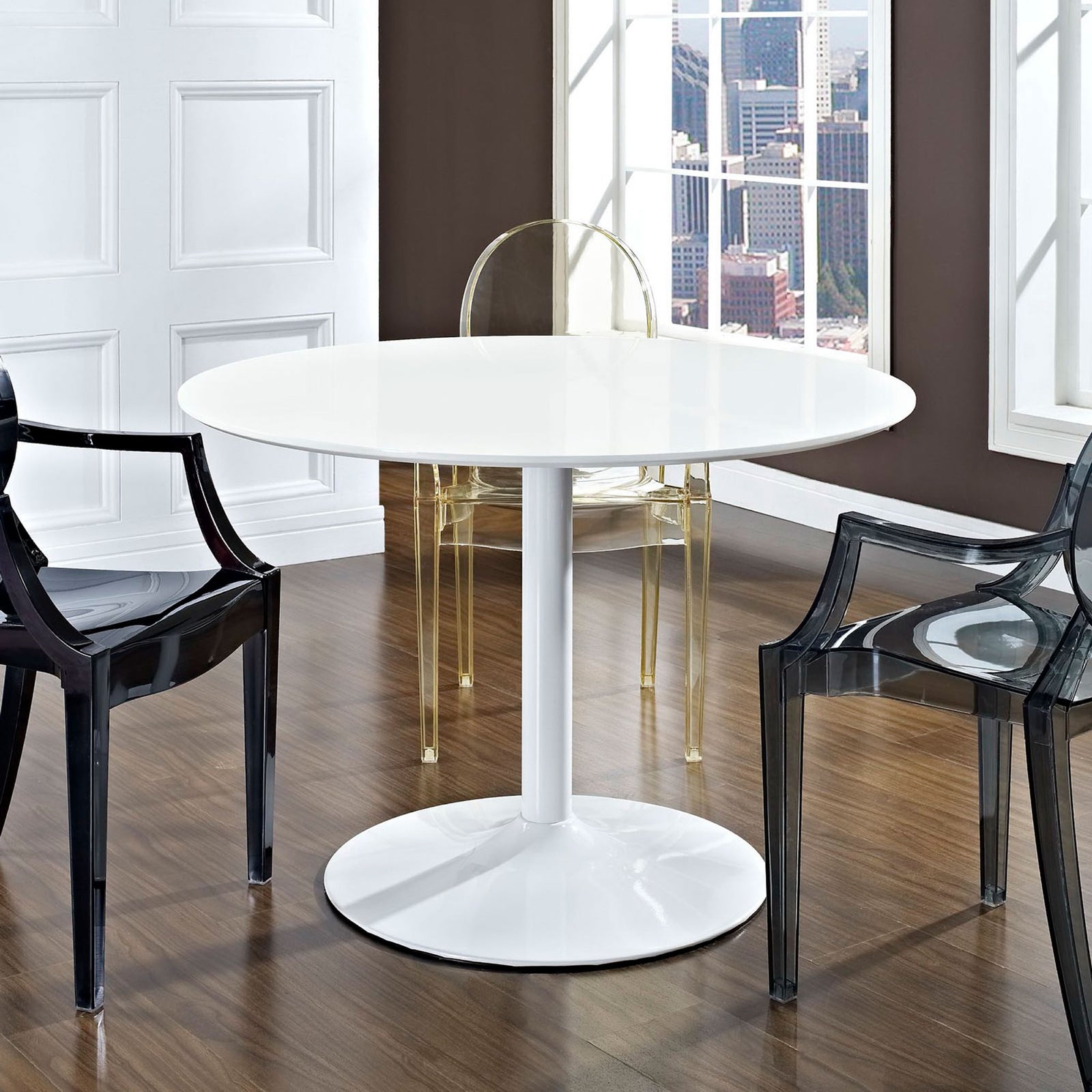 White round dining table styled in a bright modern room with transparent accent chairs. || EEI-785-WHI || front_angle_room