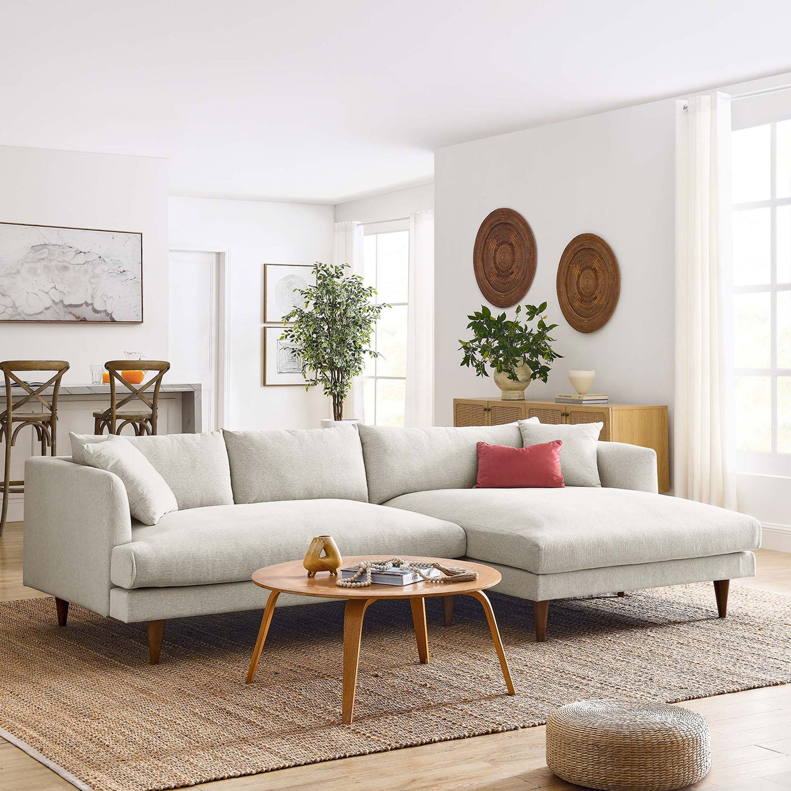 Ivory right-facing sectional styled in a bright living room with wood coffee table || EEI-6612-HEI || front_angle_room