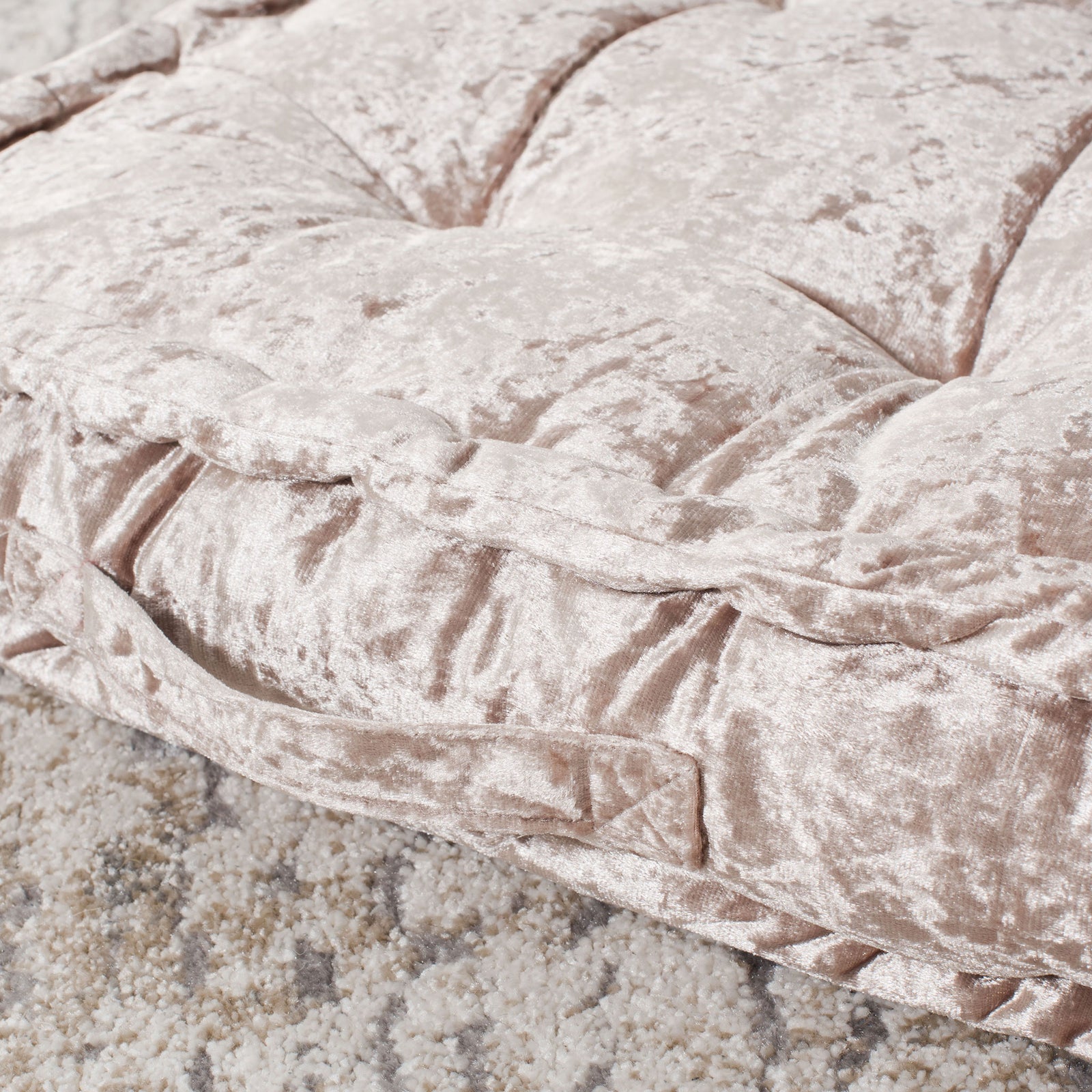 Soft champagne fabric gathers into tufting above a thick, neatly sewn border. || FLP1001F-1818 || detail_room
