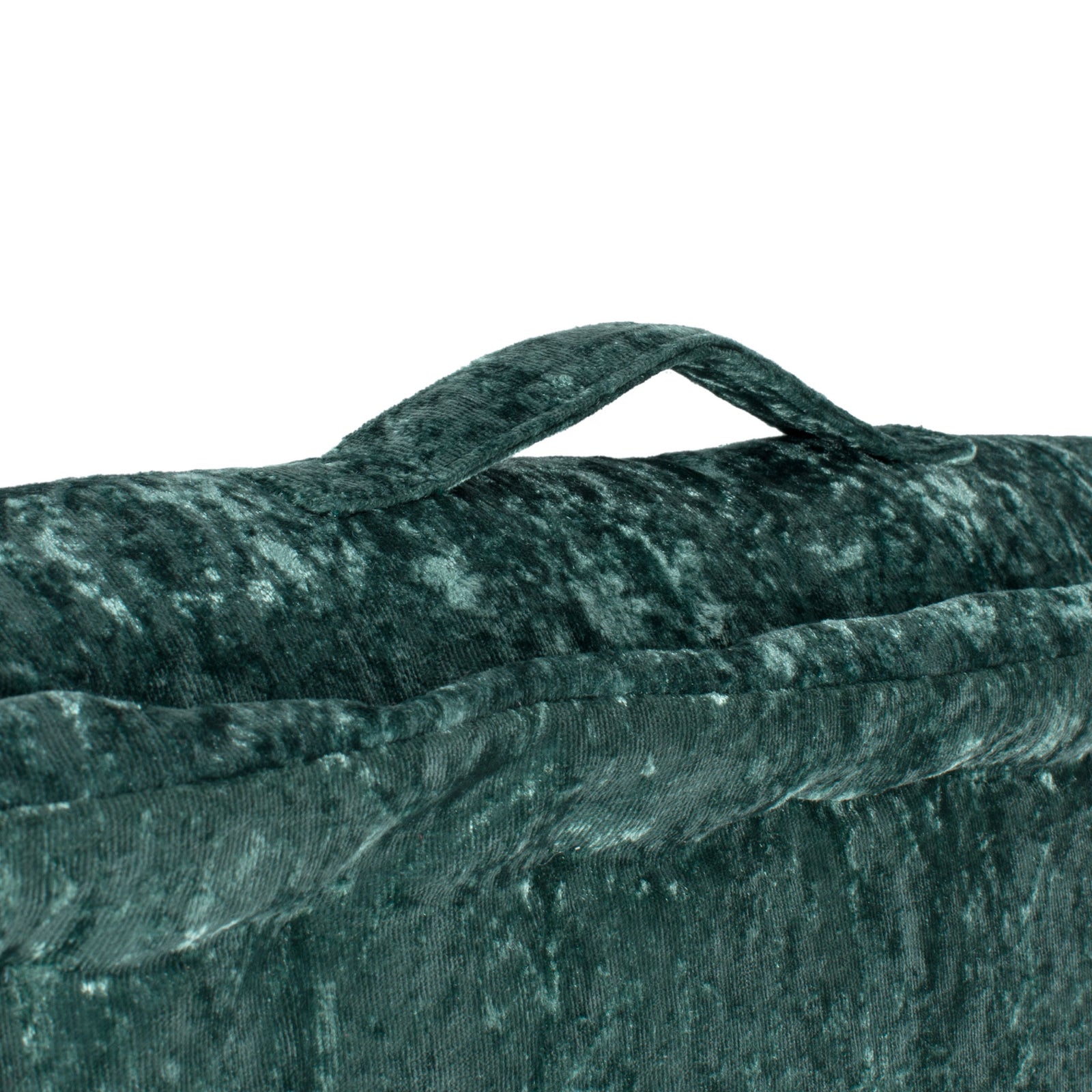 A green fabric carry loop rises from the plush cushion's tailored edge. || FLP1001J-1818 || handle_studio