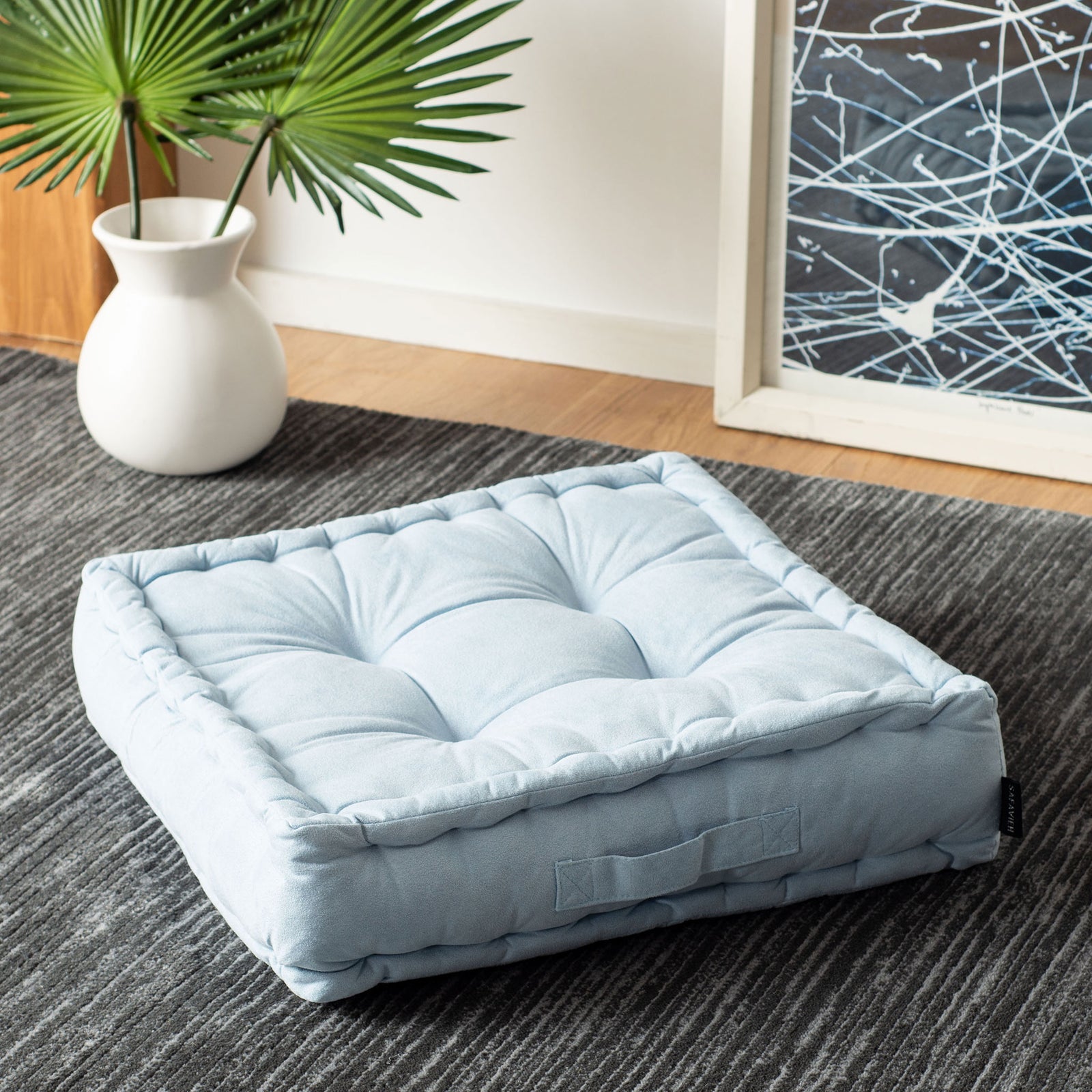 Powder blue floor pillow with pillowy tufting, a thick sidewall, and an easy-carry strap || FLP1002A || front_angle_room