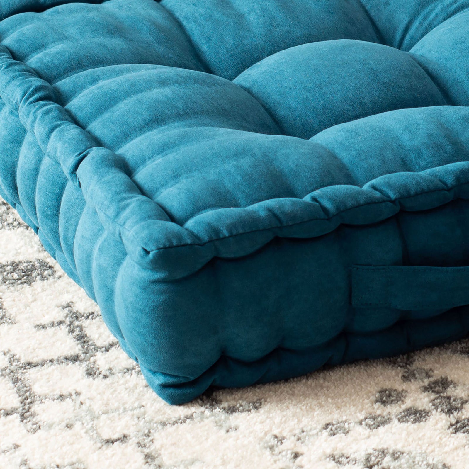 Turquoise floor pillow with plump tufted sections and a gathered, cushioned border || FLP1002B || detail_room