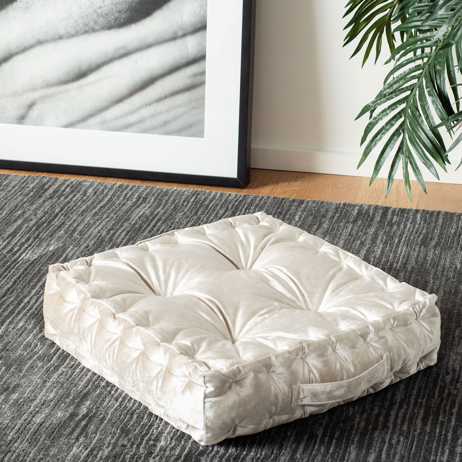 Thick, tufted white floor pillow adds an inviting spot to relax on the rug || FLP1003A || front_angle_room