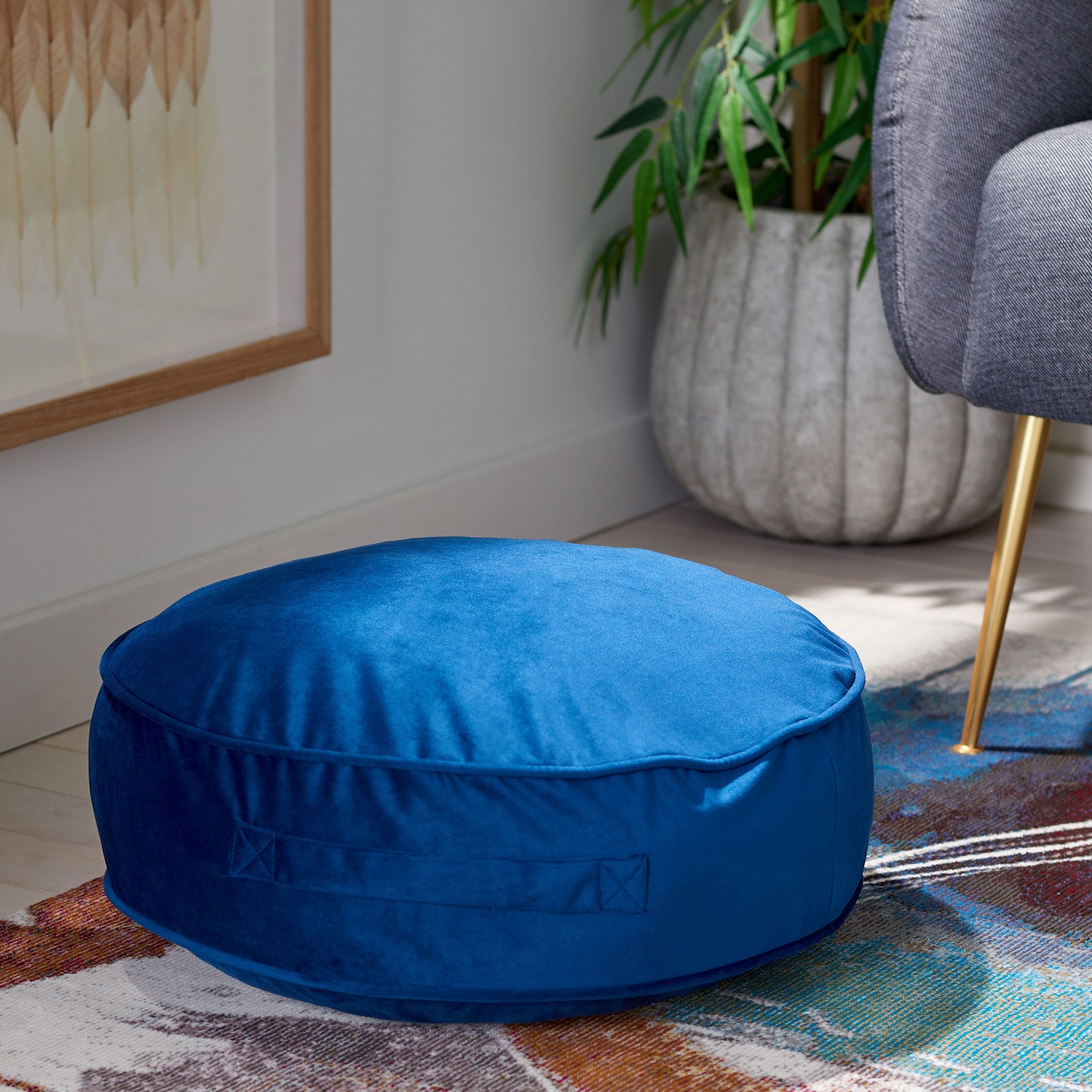 Bright royal blue floor pillow offers a soft round seat with a stitched side handle || FLP1013C || front_angle_room