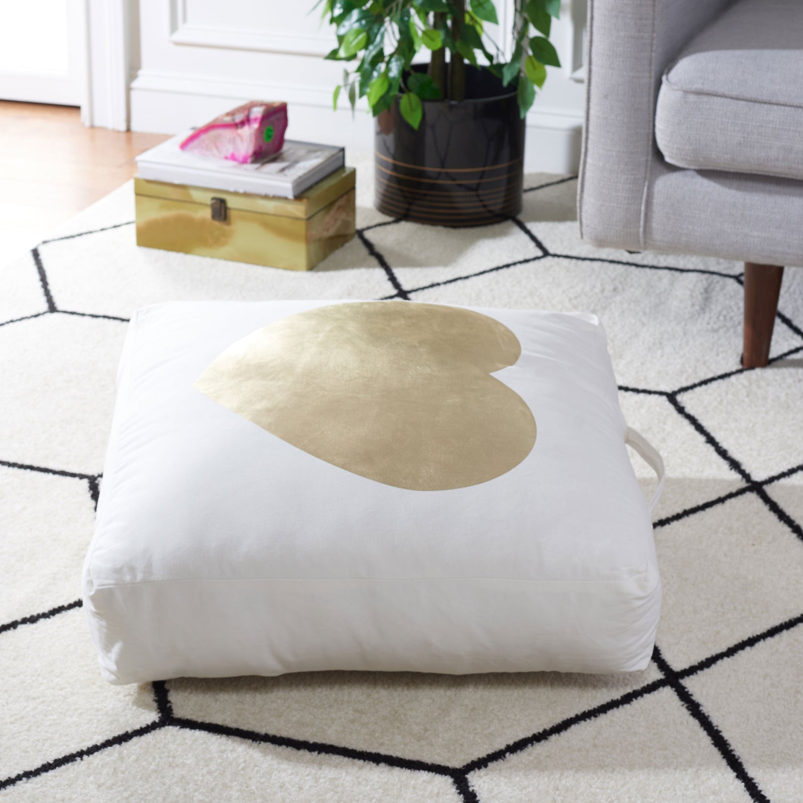 A generously cushioned beige floor pillow with a gold heart invites relaxed lounging || FLP1017A || front_angle_room